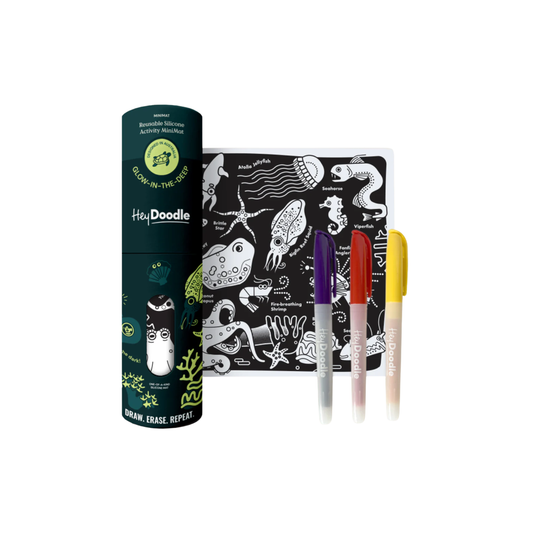 HeyDoodle Glow-in-the-Deep Mini Colouring & Doodle Mat - reusable silicone glow-in-the-dark travel mat with ocean creatures design, includes 3 non-toxic markers and pouch for mess-free creative fun on the go.