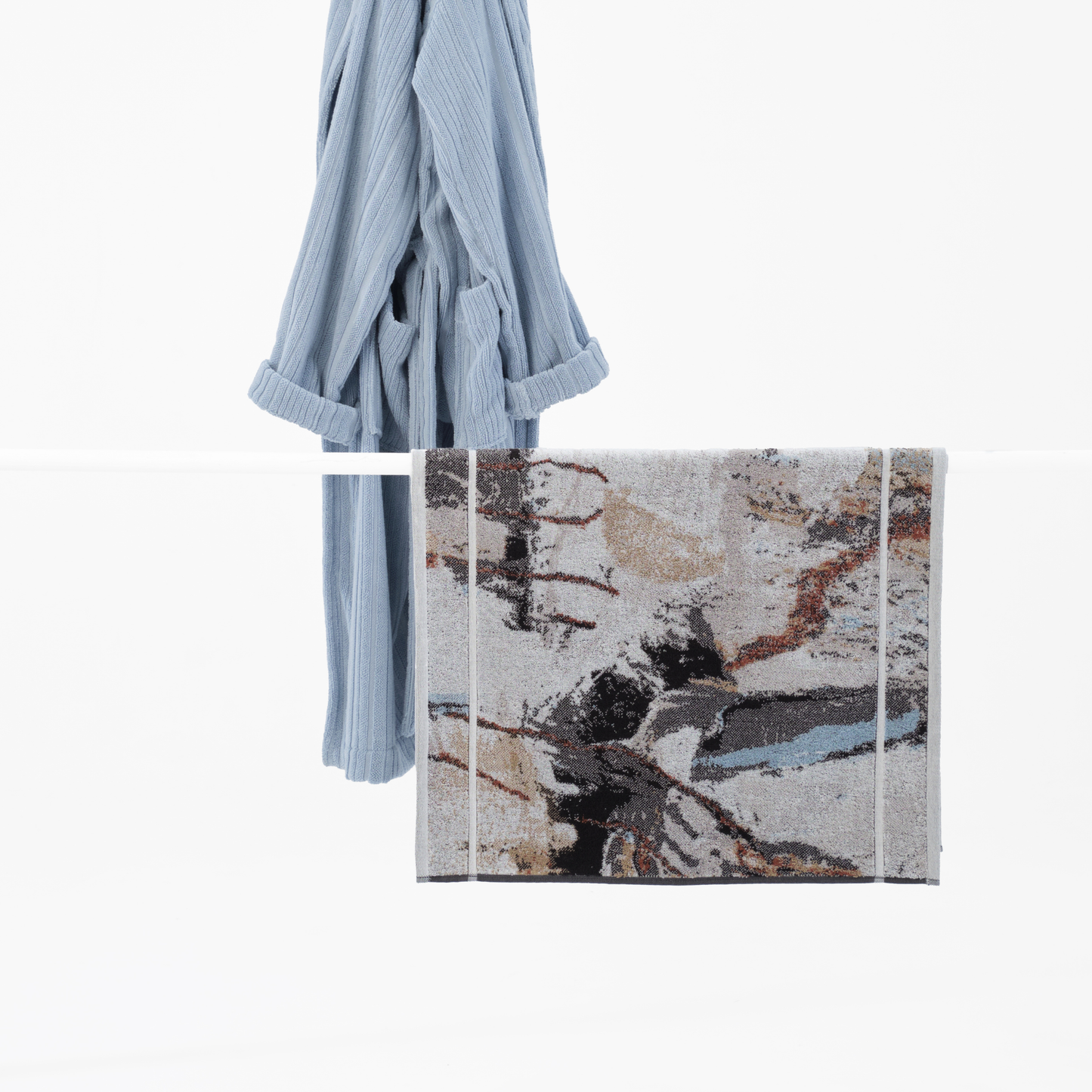 Shown with the Shale River robe, the Innate NT Morning Bath Mat 60cm x 100cm bath mat in warm earthy tones inspired by Australia's Top End landscape, made from 100% OEKO-TEX® certified cotton, featuring an absorbent six-colour jacquard weave with rich texture and weight, responsibly woven in Portugal for everyday premium use.