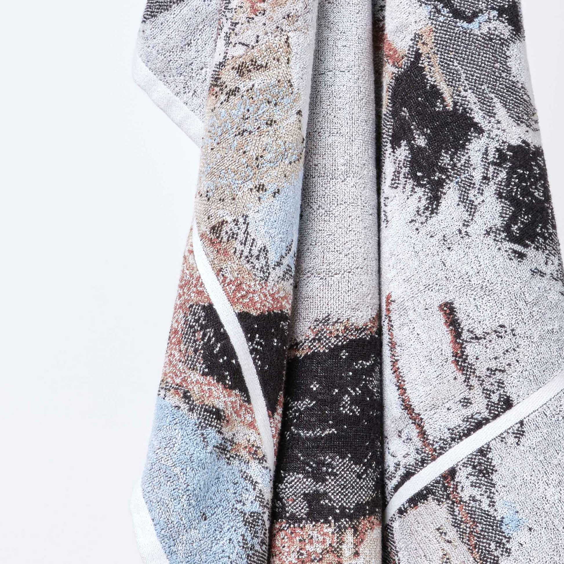 Another close up from a hung Innate NT Morning Bath Sheet 100cm x 150cm bath sheet in warm earthy tones inspired by Australia's Top End landscape, made from 100% OEKO-TEX® certified cotton, featuring an absorbent six-colour jacquard weave with rich texture and weight, responsibly woven in Portugal for everyday premium use.