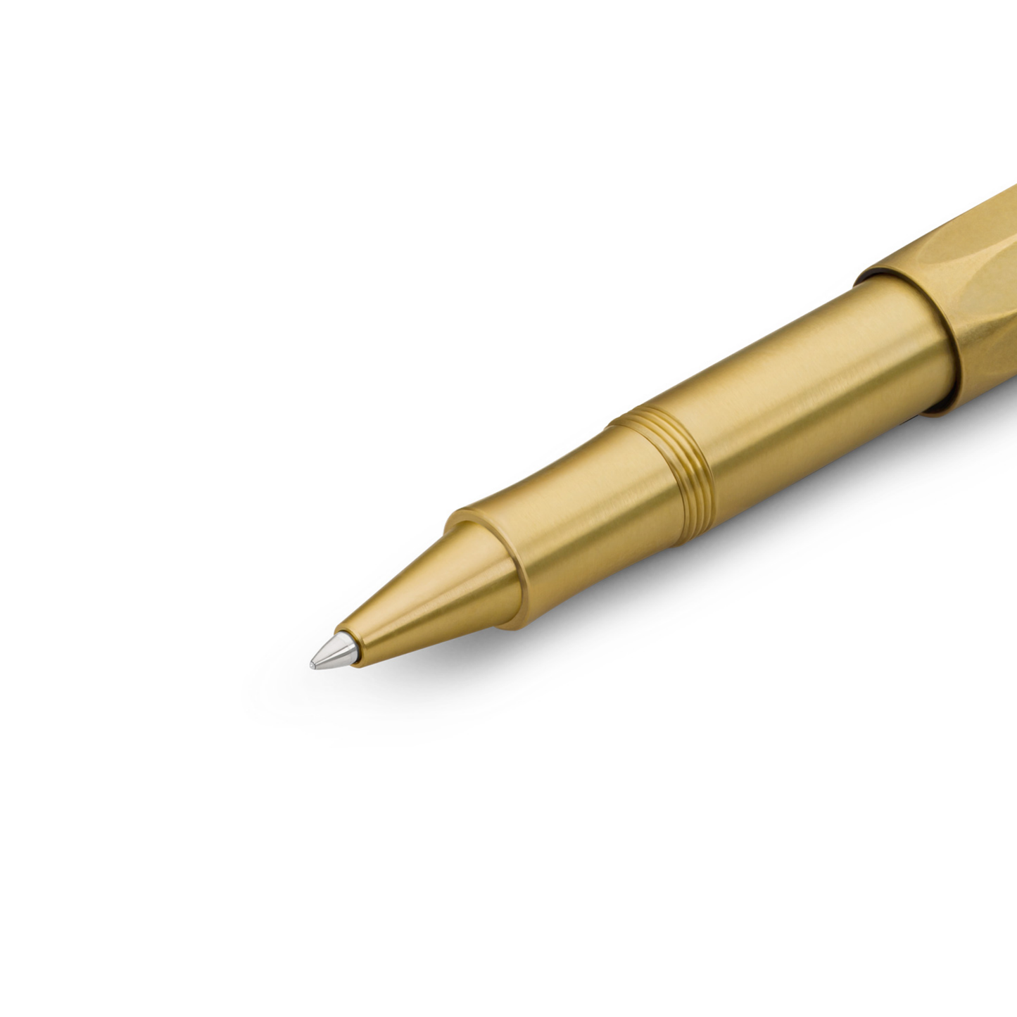 Close up of the tip of Kaweco Brass Sport Rollerball Pen - compact 10.5 cm brown brass pen with 0.7 mm black G2 refill, silver logo cap, and smooth ceramic roller for effortless writing; ages beautifully with a natural patina.