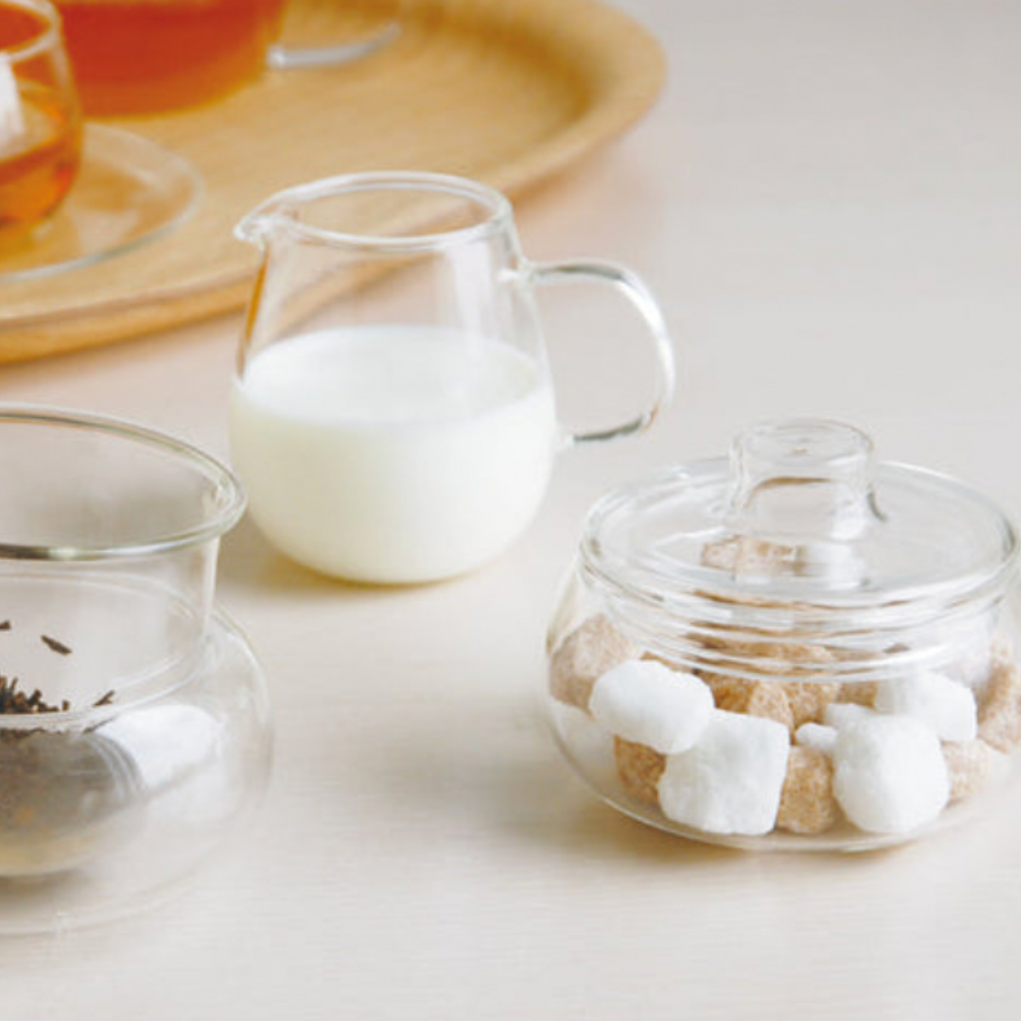 Stylish glass Unitea Sugar Pot styled with Kinto glassware with sugar cubes inside pot