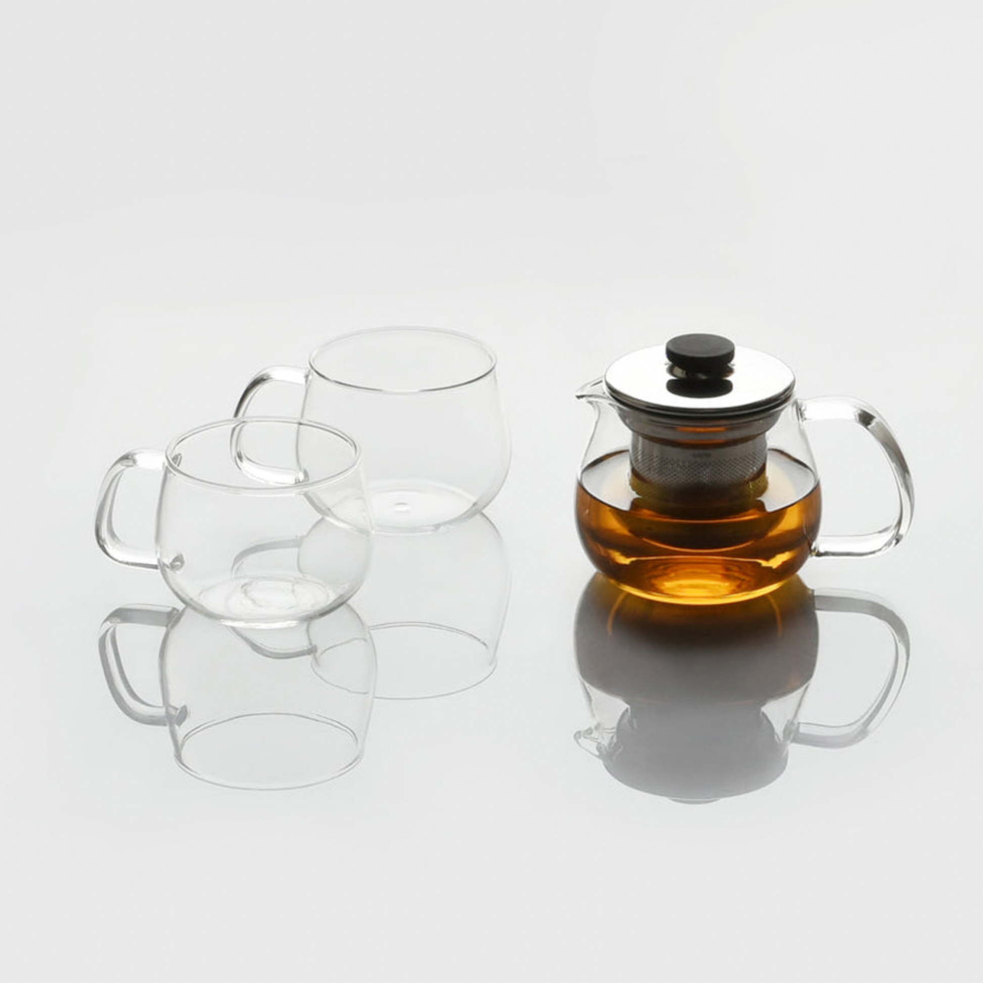 Stylish glass Kinto Unitea Teapot 500ml with stainless steel strainer and lid on display with other Kinto glassware