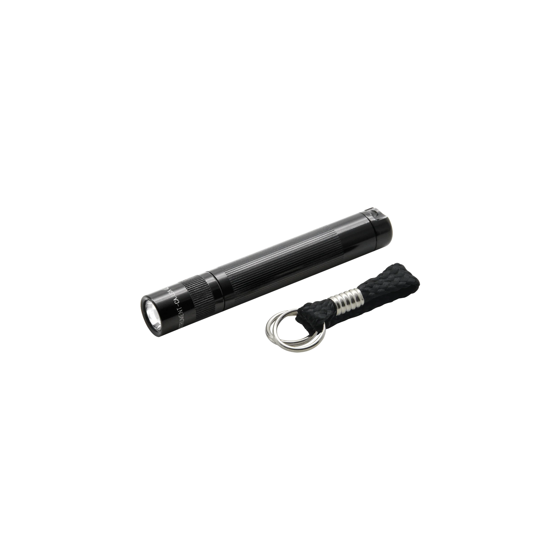 Side lying down view of black solitare Maglite torch with accessories 