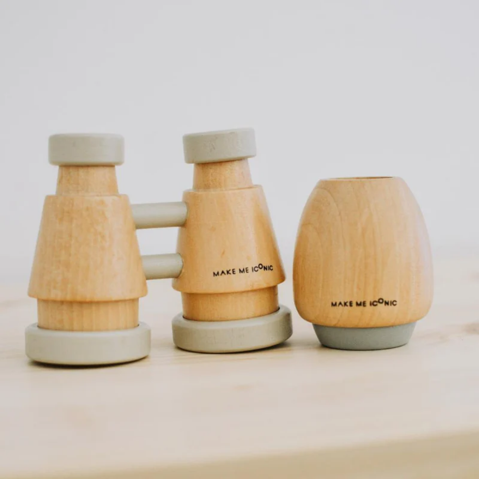 Showing the wooden binocular with the Make Me Iconic wooden kaleidoscope - solid wood kaleidoscope in yellow or soft grey, designed for kids to explore light, color, and patterns through imaginative, screen-free play.