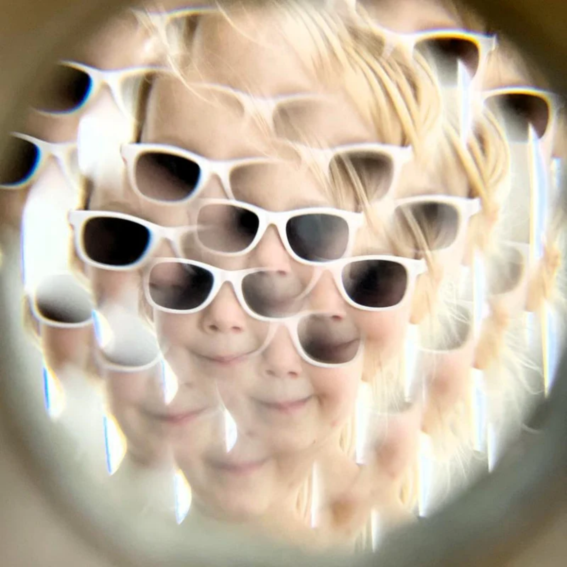 Showing the kaleidoscope image effect from Make Me Iconic wooden kaleidoscope - solid wood kaleidoscope in yellow or soft grey, designed for kids to explore light, color, and patterns through imaginative, screen-free play.