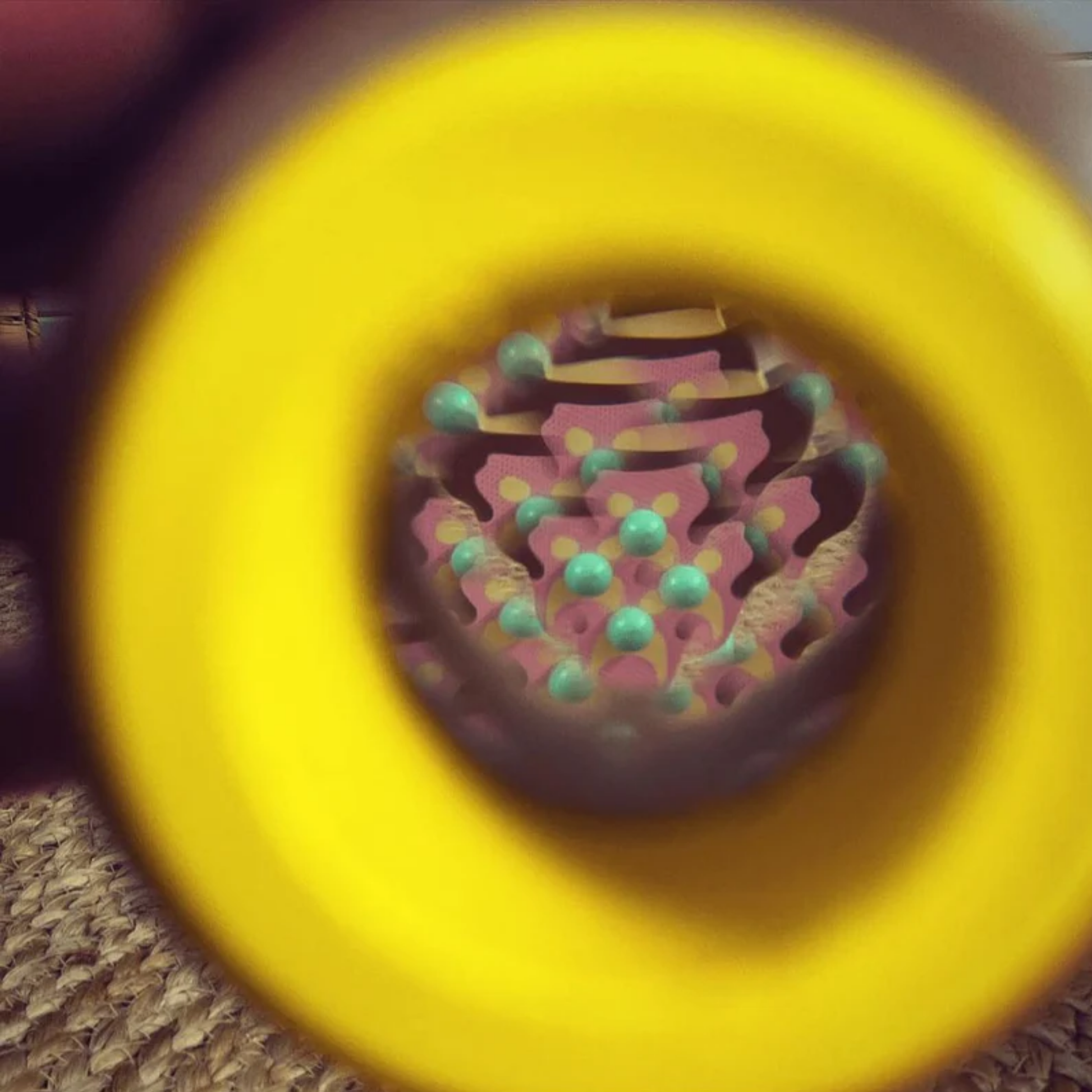 Showing the kaleidoscope image effect from Make Me Iconic wooden kaleidoscope - solid wood kaleidoscope in yellow or soft grey, designed for kids to explore light, color, and patterns through imaginative, screen-free play.