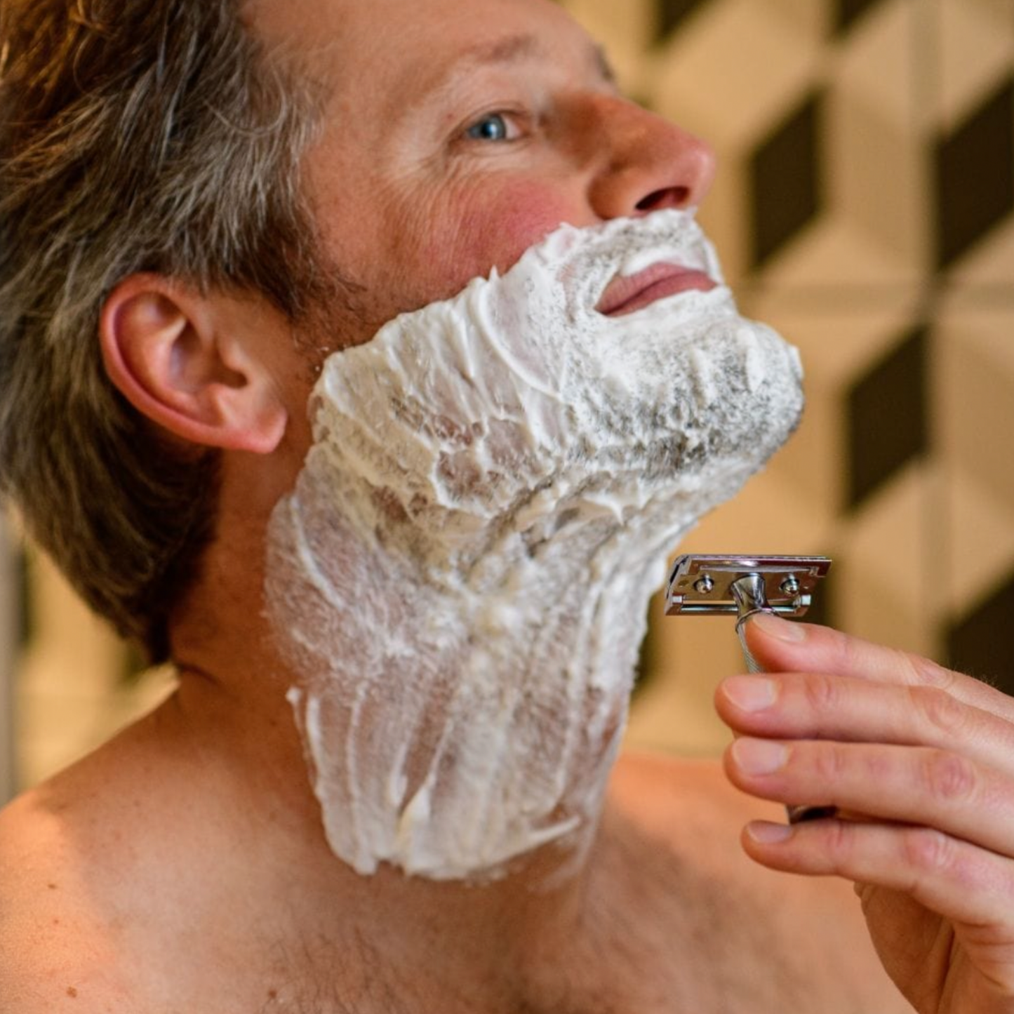 Man using Stylish Merkur Safety Razor 34C Chrome to shave his beard 