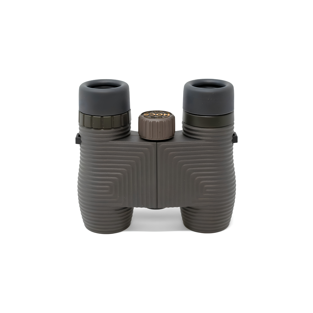 Nocs Provisions Binocular Standard Issue 8X25 Charcoal black that has multi-coated lenses and premium BaK4 prisms, waterproof, fogproof and compact, showing the lenses down on the surface.