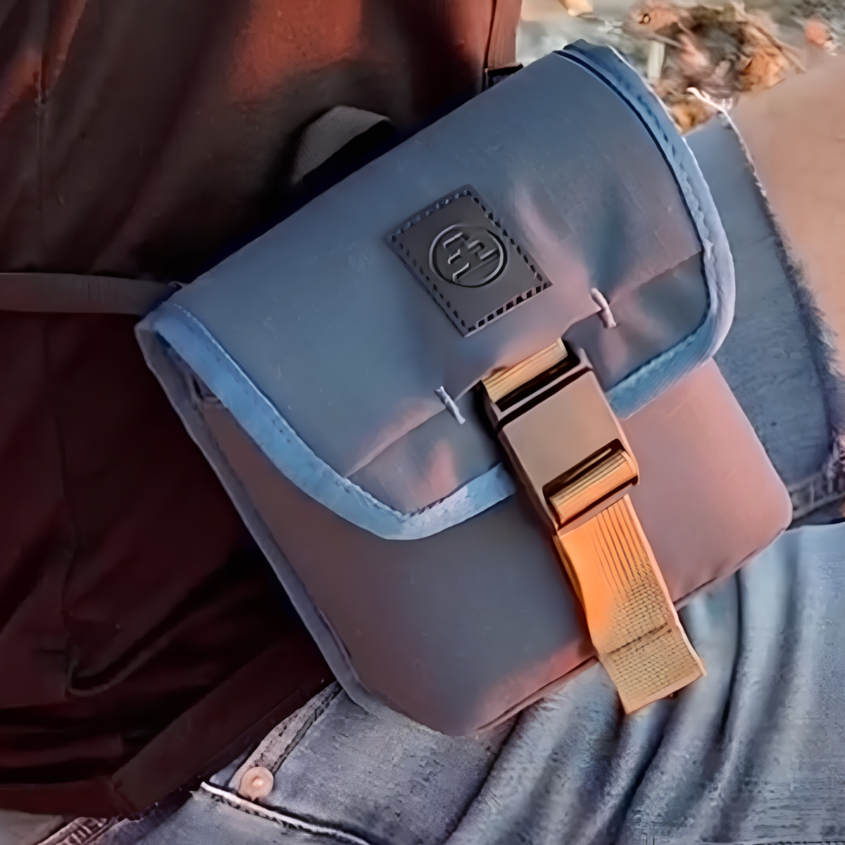 Nocs Provisions Binocular Standard Issue Pouch in harbor blue, recycled abrasion-resistant fabric with secure NocLoc closure, universal strap attachments and internal storage pocket, ideal for 25mm binocular, seen across the hips.