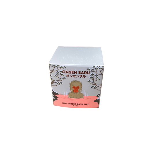 Front and back view of the box from Onsen Saru Hot Spring Bath Fizz that has blend of sea salts, magnesium and pink kaolin clay, a 2 inch cube wrapped in biodegradable Biolefin.