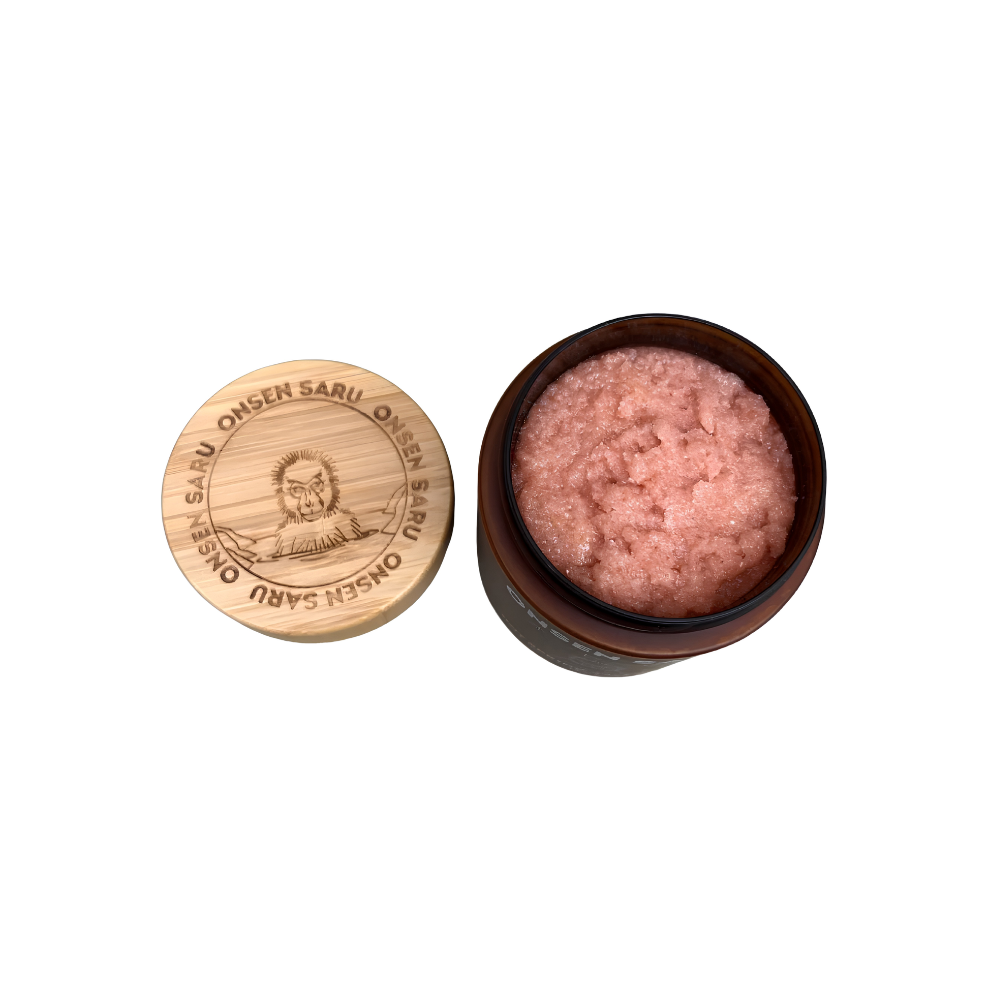 Open and showing the engraved logo of the Onsen Saru Hot Spring Salt Scrub 14oz jar, frosted amber plastic, engraved bamboo lid and cardboard box