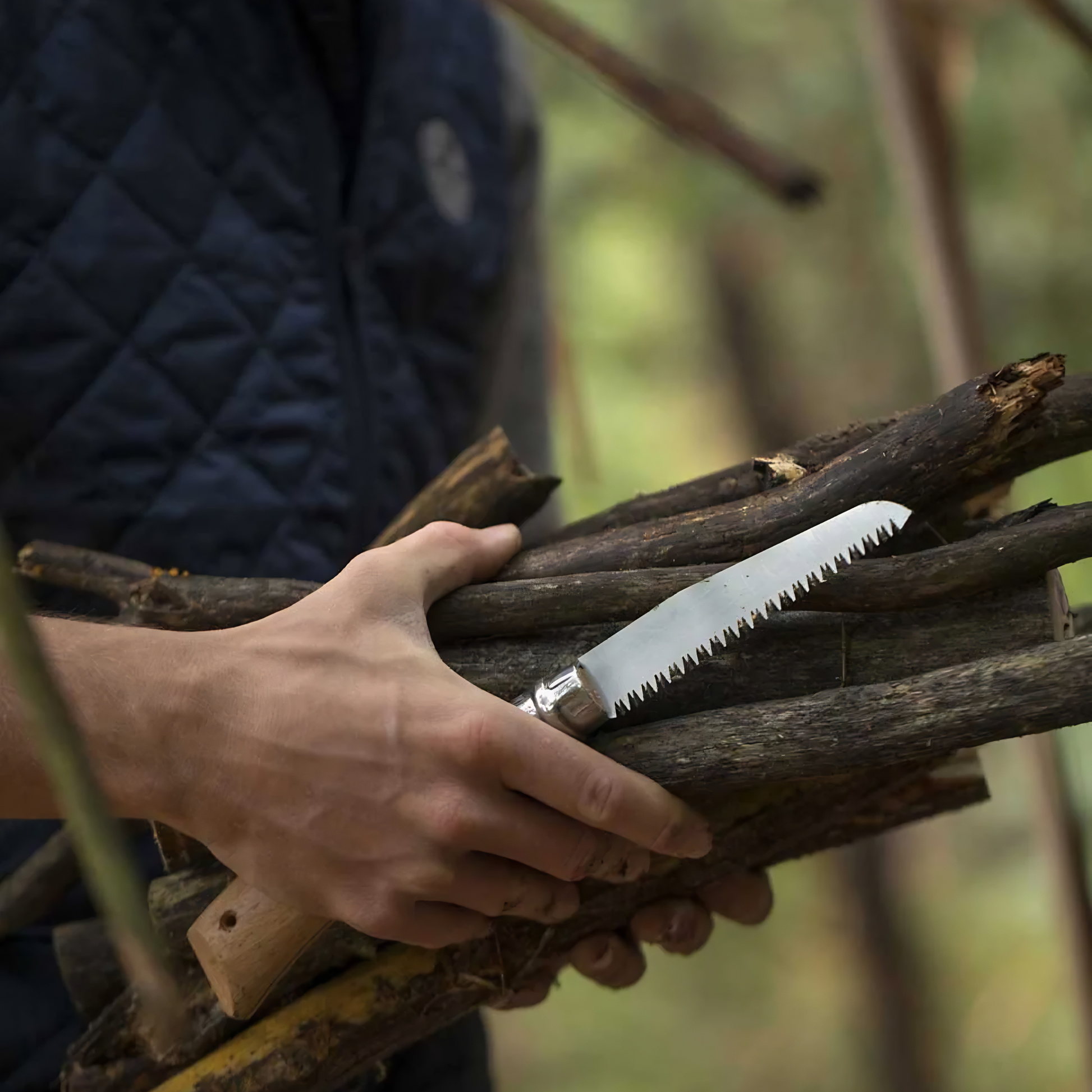 Showing cut twigs with the Opinel Traditional Folding Saw No12 Stainless Steel Beech with 12 cm blade.