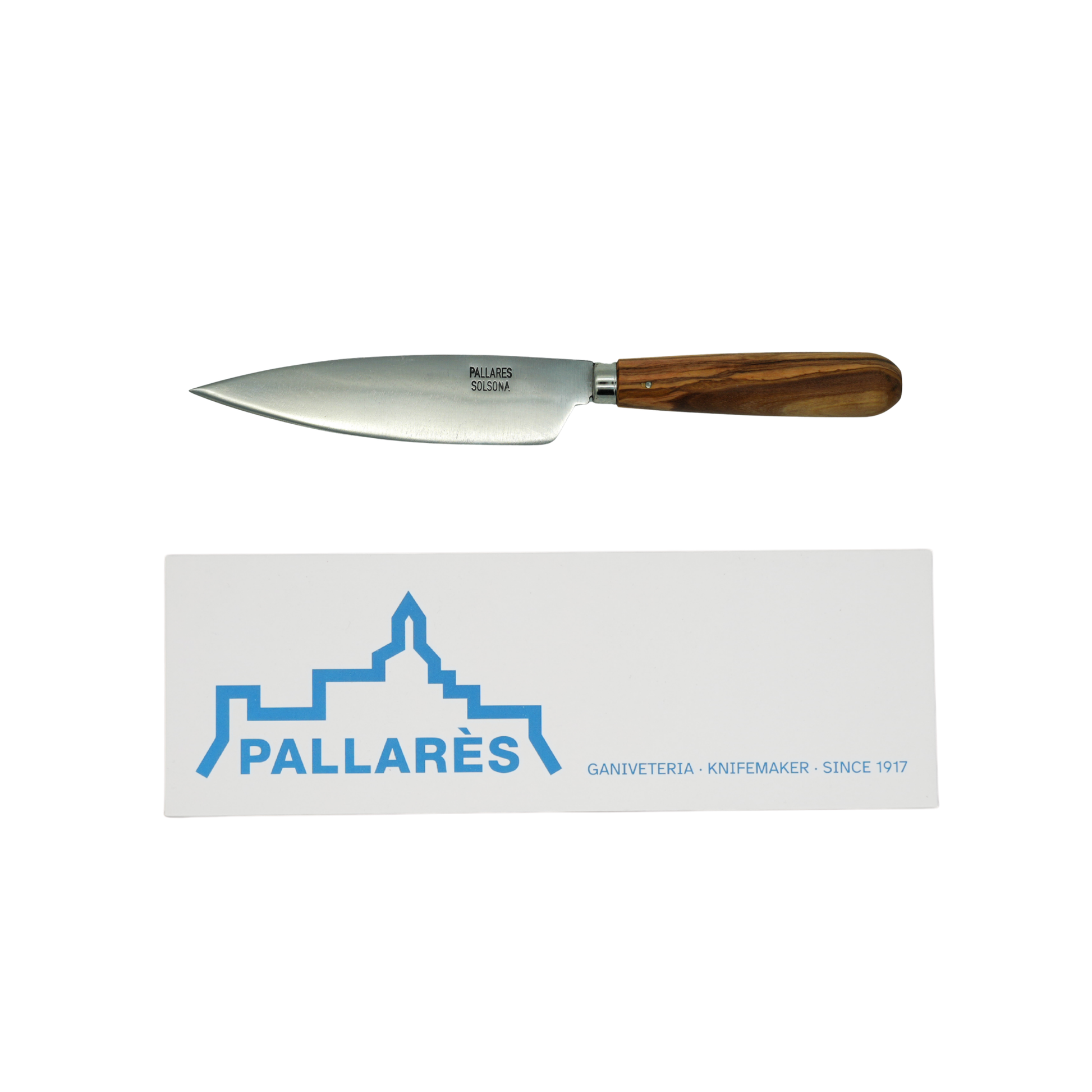 Showing the knife and the box from Pallares Solsona Kitchen Knife 13cm Wide Blade Carbon Steel Olive Wood Handle.