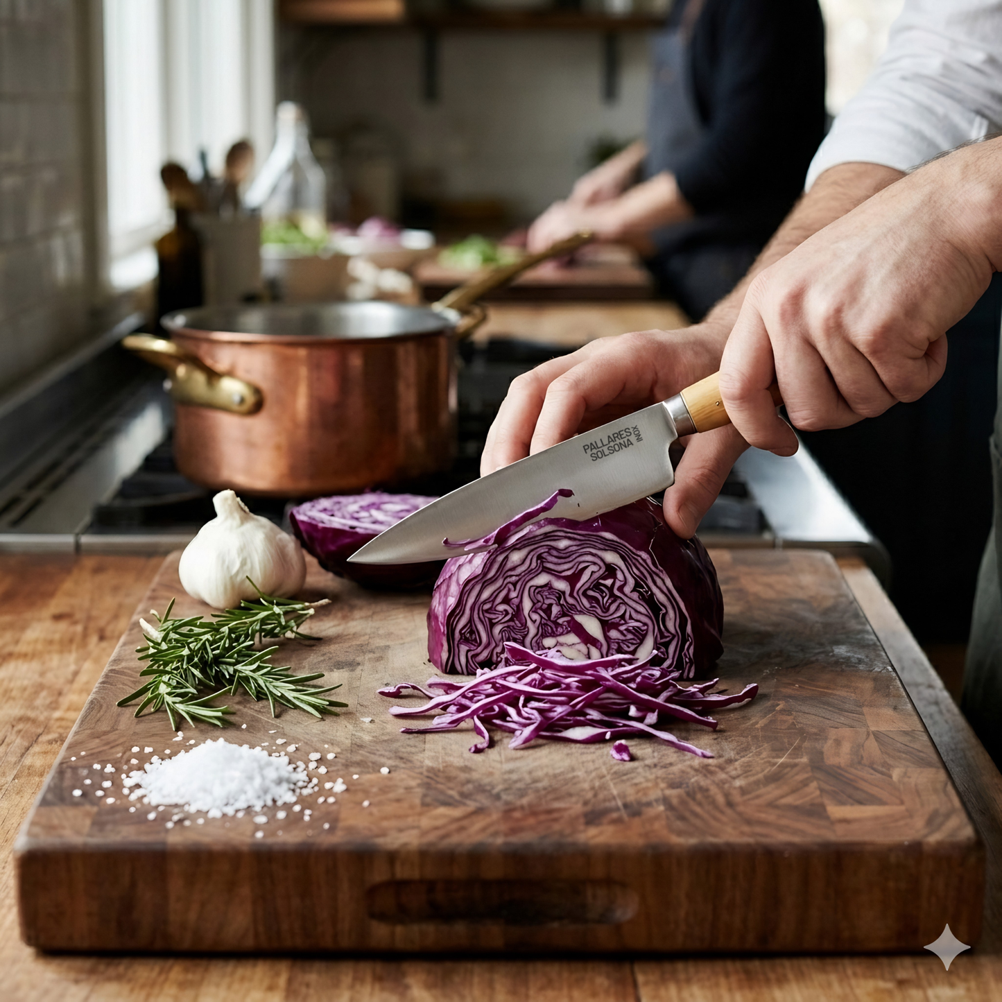 Pallares Solsona Kitchen Knife 13cm Wide Blade Stainless Steel Boxwood Handle shown in use in the kitchen.