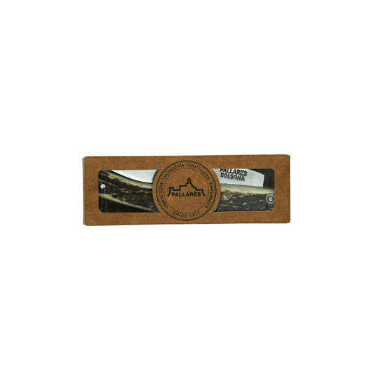 Shown inside a paper box, the Pallares Solsona Pocket Knife Busa 8cm Carbon Steel Deer Horn Handle