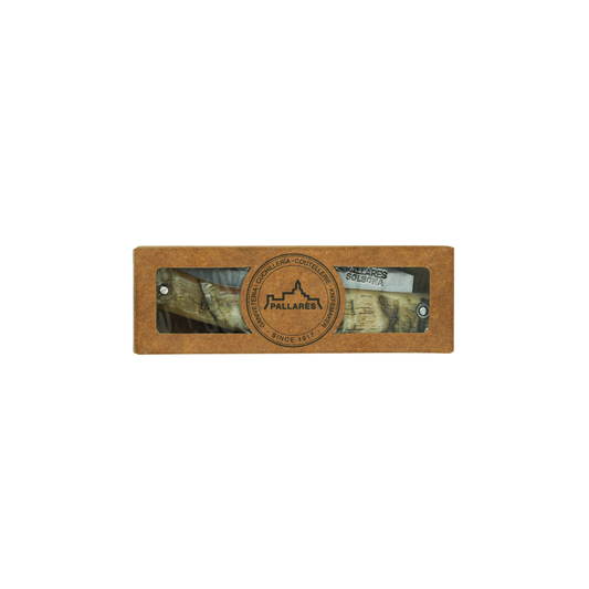 Shown inside a paper box, the Pallares Solsona Pocket Knife Busa 8cm Carbon Steel Ram Horn Handle