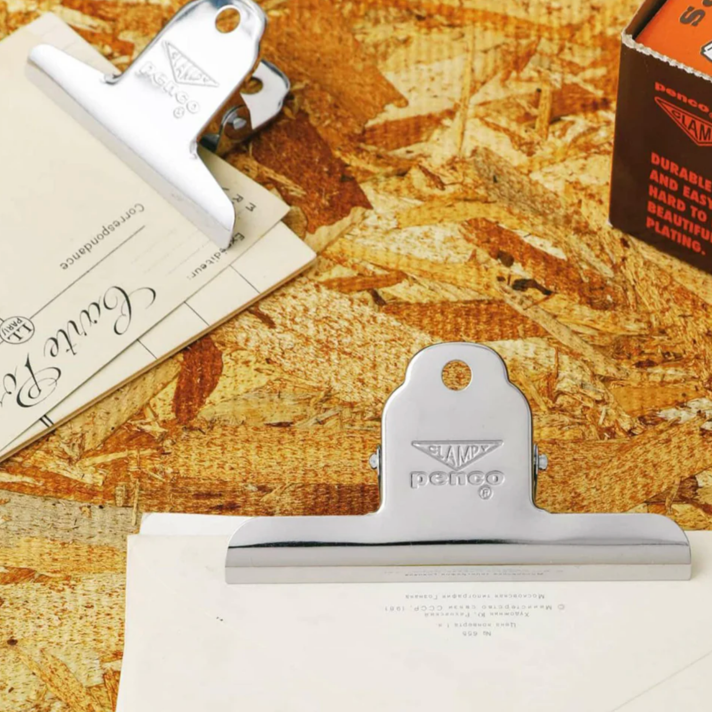 Close up of Metal medium Penco clip on display together on wooden table