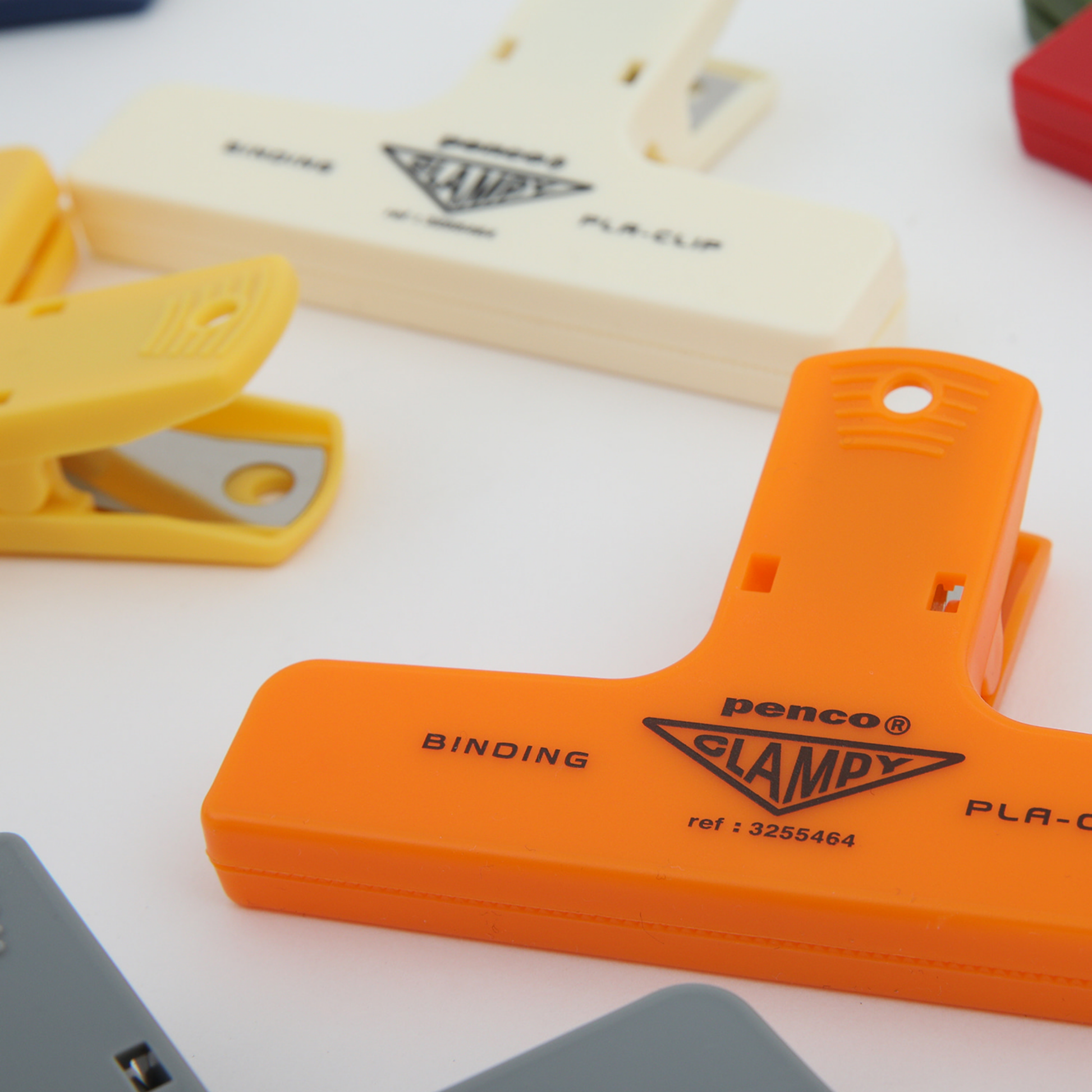 Close up of plastic orange Penco clip 