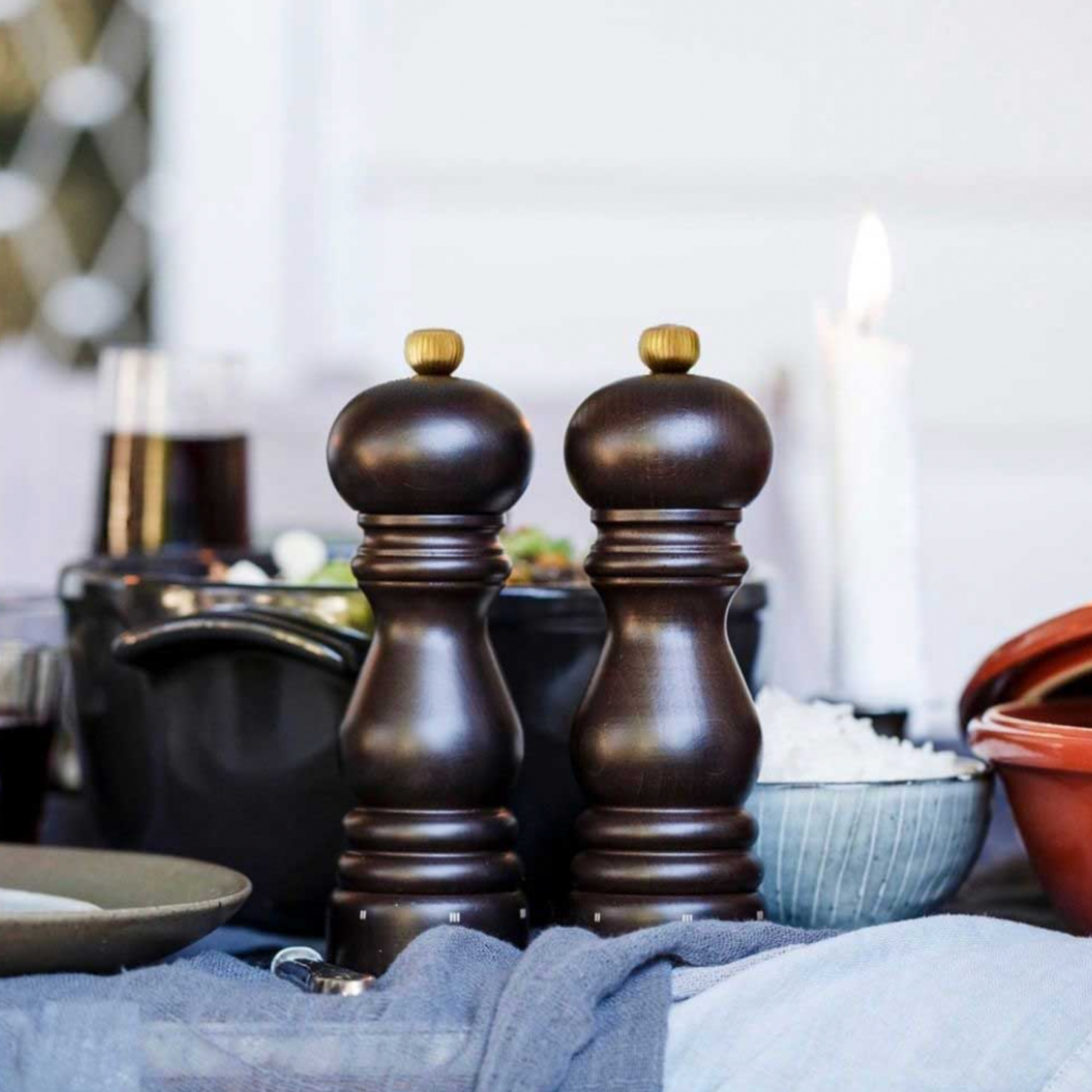 Pair of Peugeot Paris uSelect Pepper Mill 18cm Chocolate displayed on set dinning room table