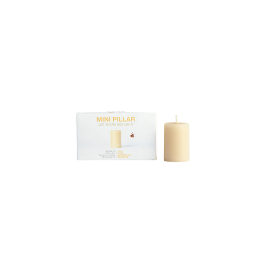 Queen Bee mini pillar candles box of 3 candle next to box