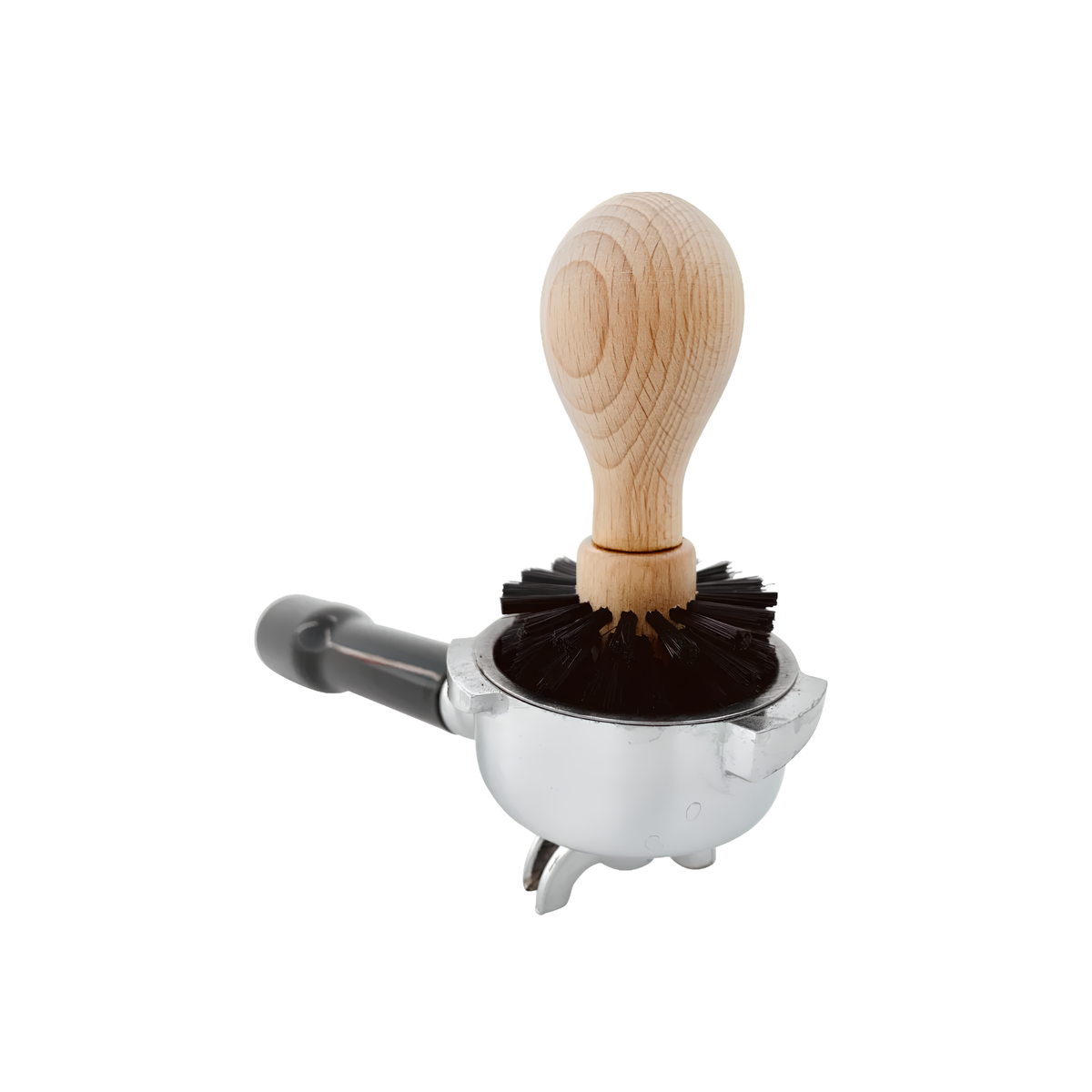 Redecker Espresso Basket Brush which is made of oiled beechwood and black firm nylon bristles, removes powder residue, shown on top of the portafilter.