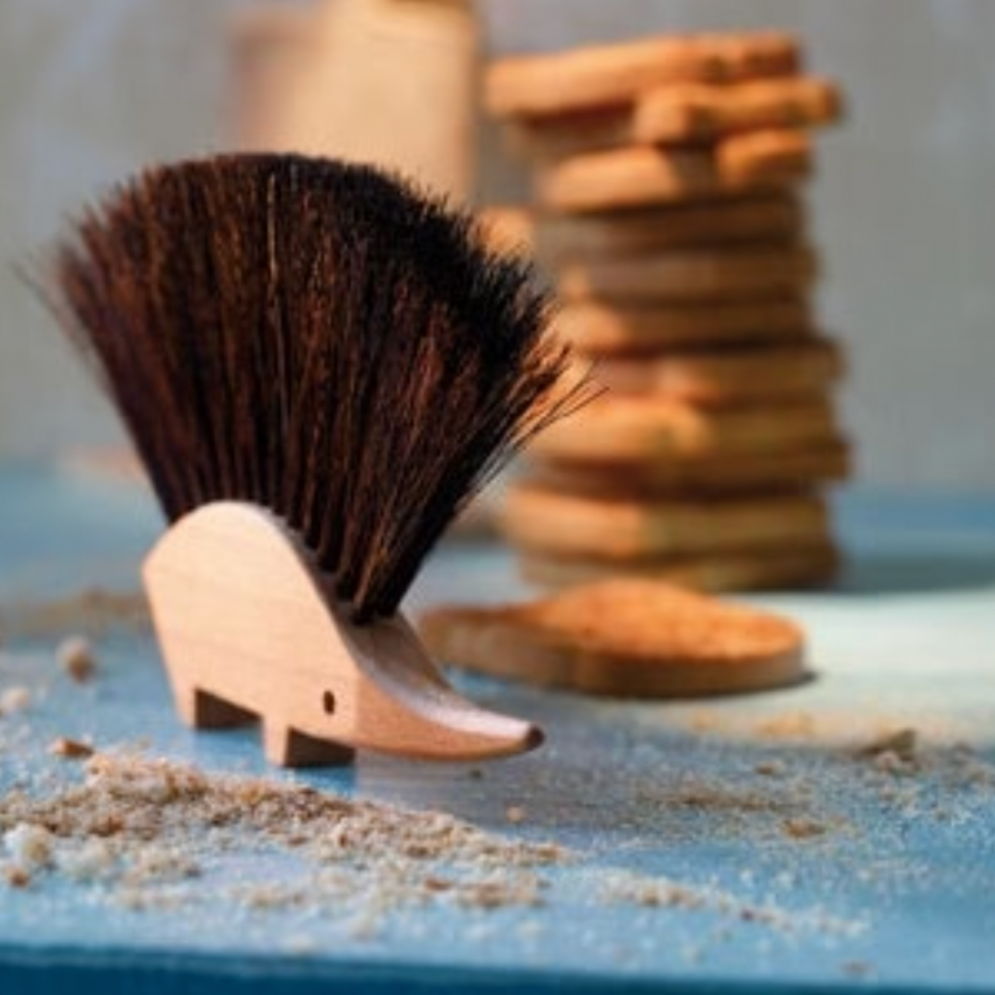 Redecker hedgehog brush on chopping board with toast and crumbs