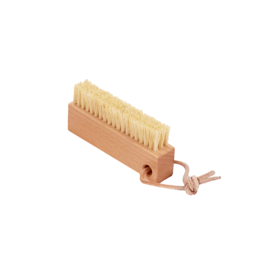 Redecker nail brush with leather strap angled view of bristles and base 