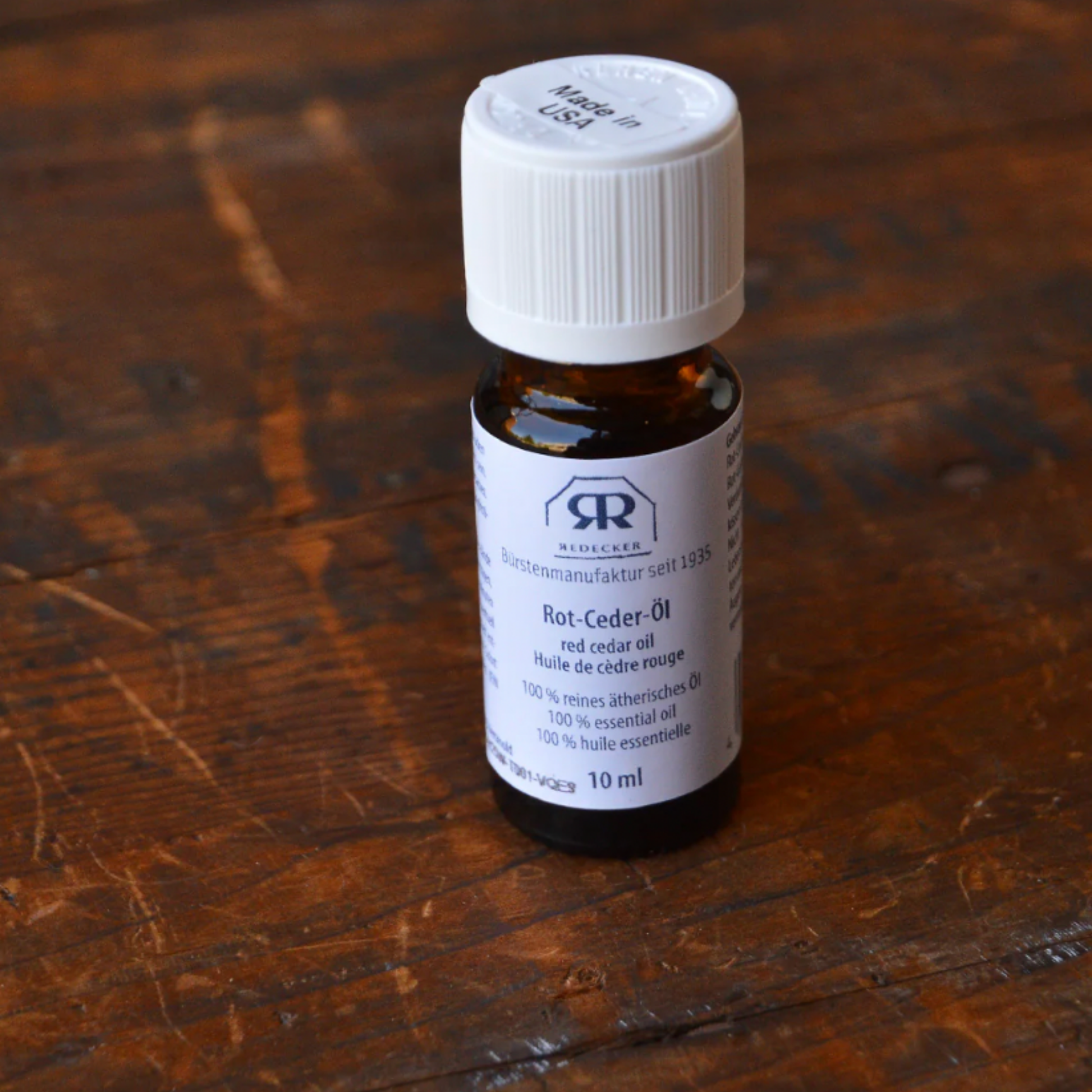 Redecker red cerad oil on display on wooden table 