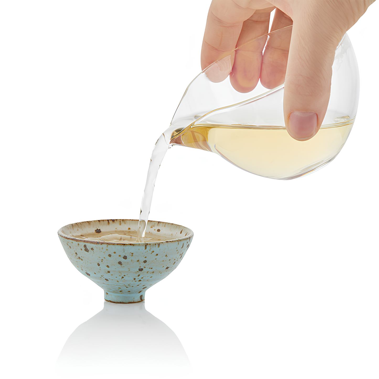 Pouring the the blend in to a small bowl, using the Ripple Effect Tea Co Loose Leaf Tea 50g Meaningful Green, wild green tea leaves, Red clover blossoms, Lemon verbena and Gynostemma vine. Antioxidant and healthy.