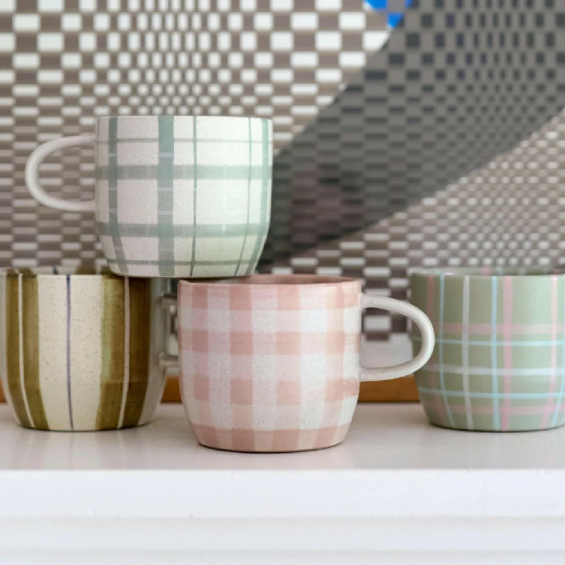 Robert Gordon cats pyjamas mug soft terracotta check side view on display with Robert Gordon range