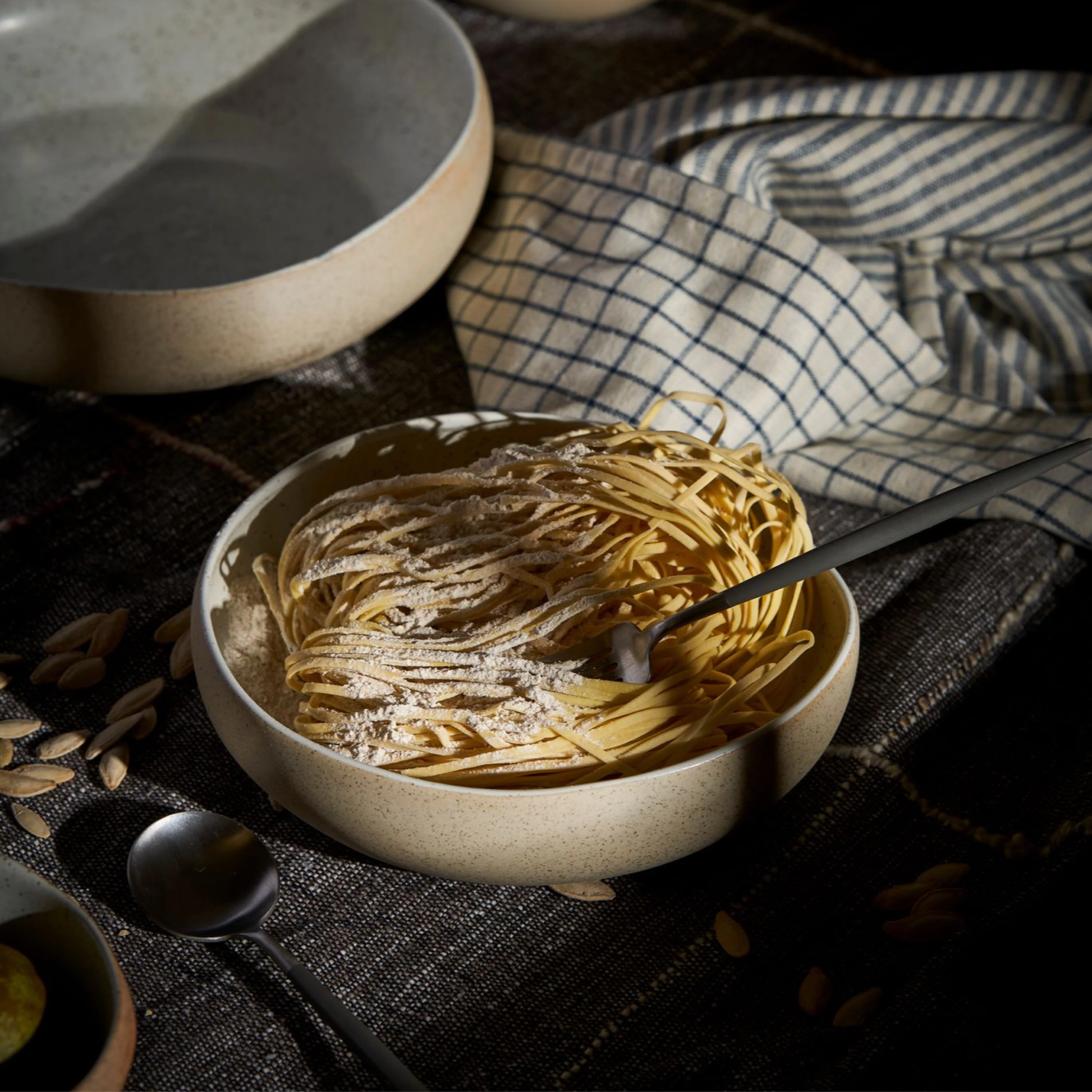Robert Gordon Garden To Table Bowl 21cm Beige and white Earthly clay body with light organic glaze and dark speckles, hand crafted made from stoneware, microwave and dishwasher safe, designed in Australia, made in China, with pasta inside.