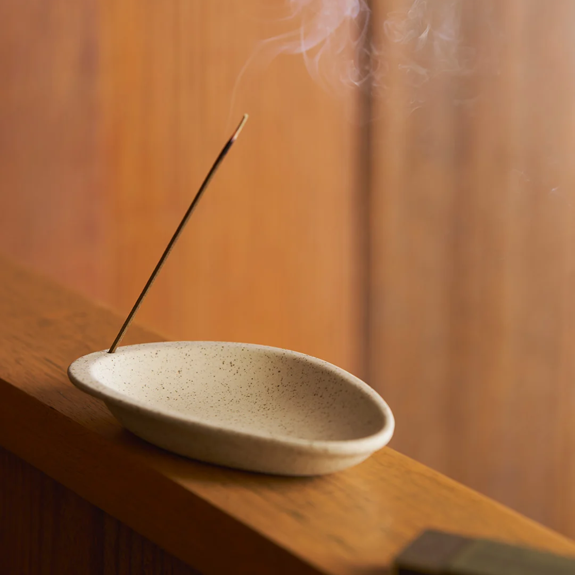 Showing incense on the Robert Gordon Garden To Table Incense Burner made from durable stoneware for simple rituals.