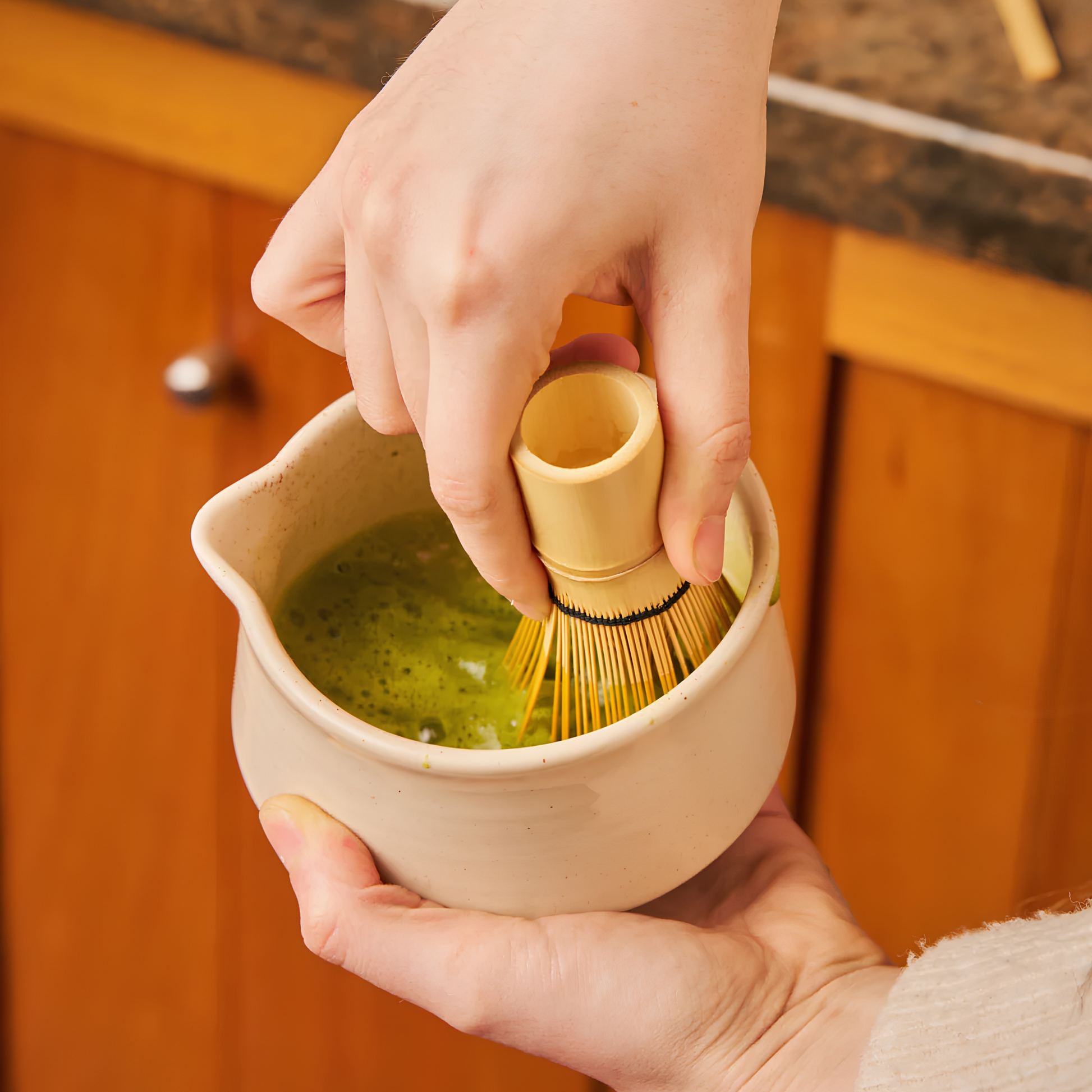 Whisking matcha in the ceramic bowl from the Robert Gordon Matcha 4-Piece Set