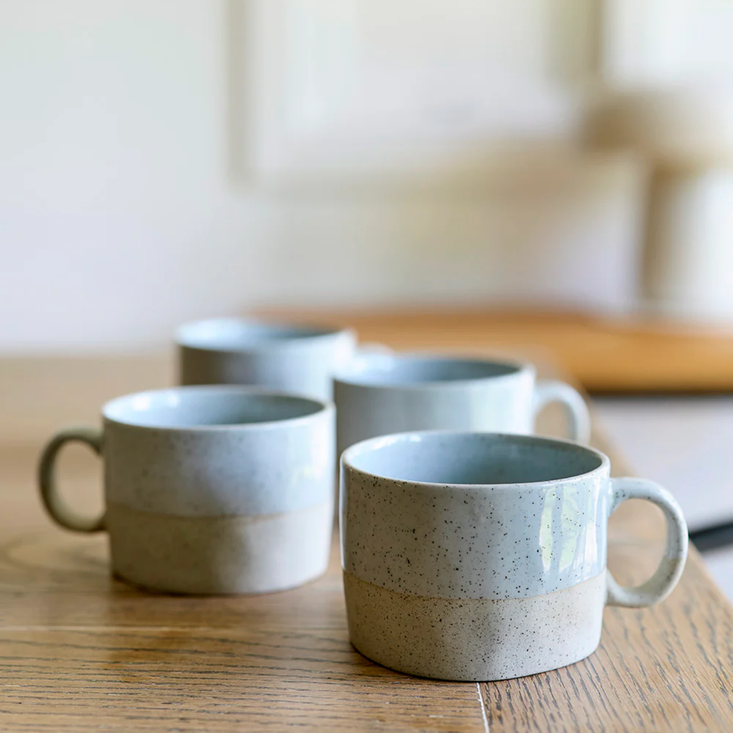 Robert Gordon mineral mugs rock set of 4 on display on wooden table staggered