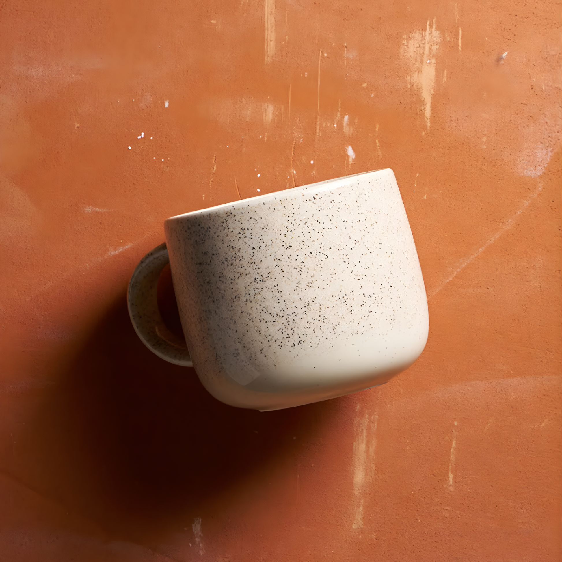 Laid on a surface, the Robert Gordon My Mug (set of 4) Celestial 350ml capacity Off-white featuring delicate speckling giving charm and character, made from durable stoneware, microwave and dishwasher safe, designed in Australia, made in China.