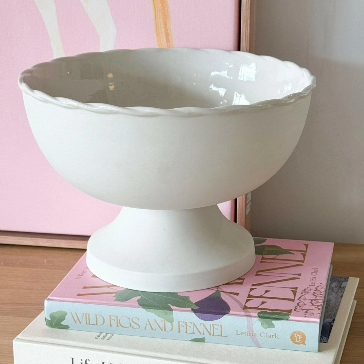 Robert Gordon vintage table fruit bowl vanilla side view on coffee table on books