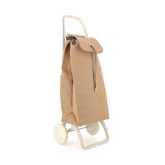 Front tilted view of Rolser I-MAX YUTE two-wheel aluminum trolley with off-white chassis and natural jute bag, fold-down base for compact storage, backpack-style format with double interior pockets, drawstring and flap closure, lightweight and sustainable design ideal for carrying laundry, groceries, or beach items.