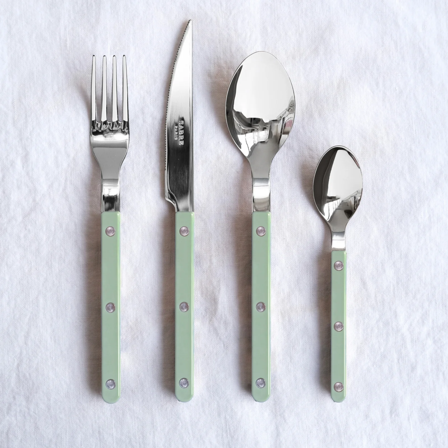Showing the fork, knife, spoon and teaspoon from the Sabre Bistrot Cutlery Asparagus 24 Piece Set