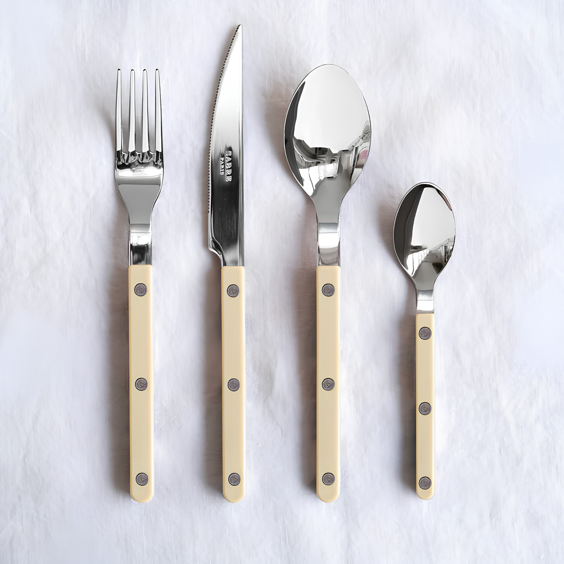 Fork, knife, teaspoon and spoon from Sabre Bistrot Cutlery Ivory 24 Piece Set