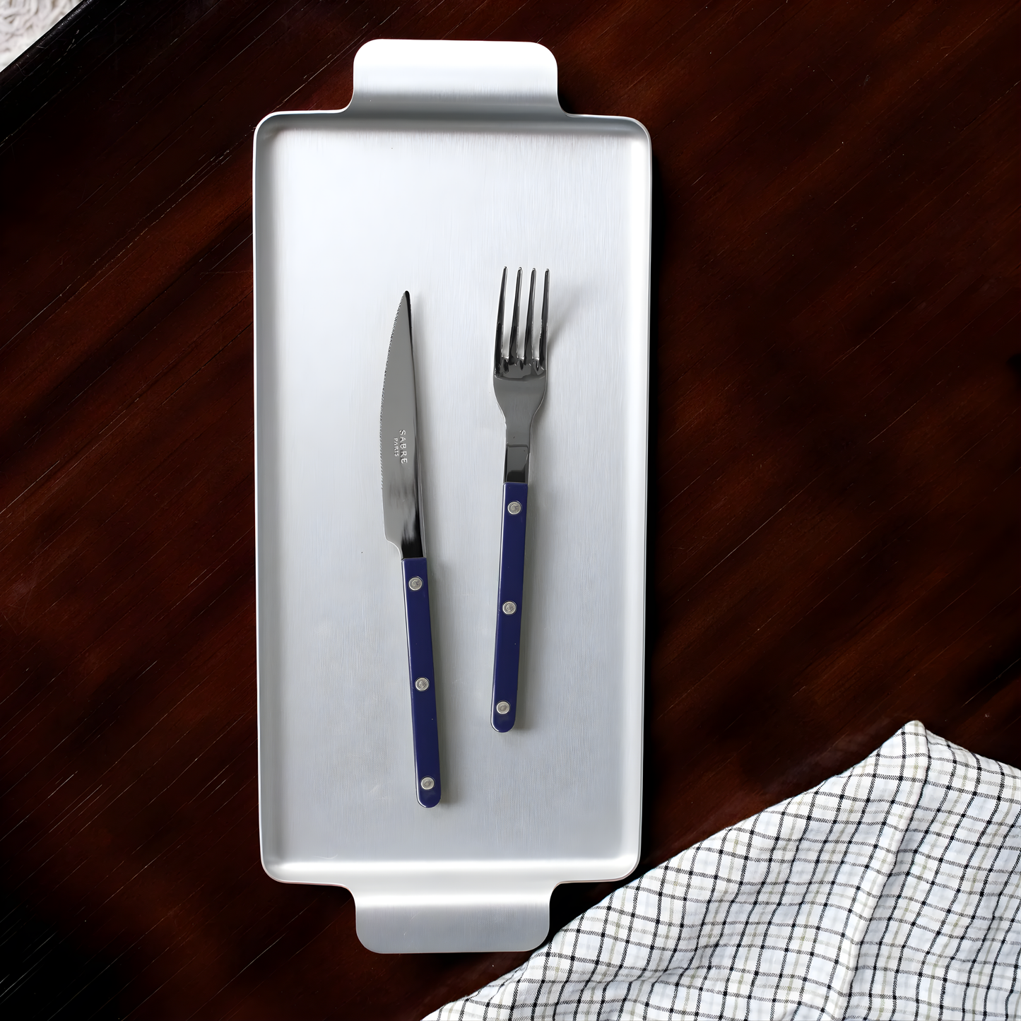 Knife and fork on a silver tray, from Sabre Bistrot Cutlery Navy Blue 24 Piece Set