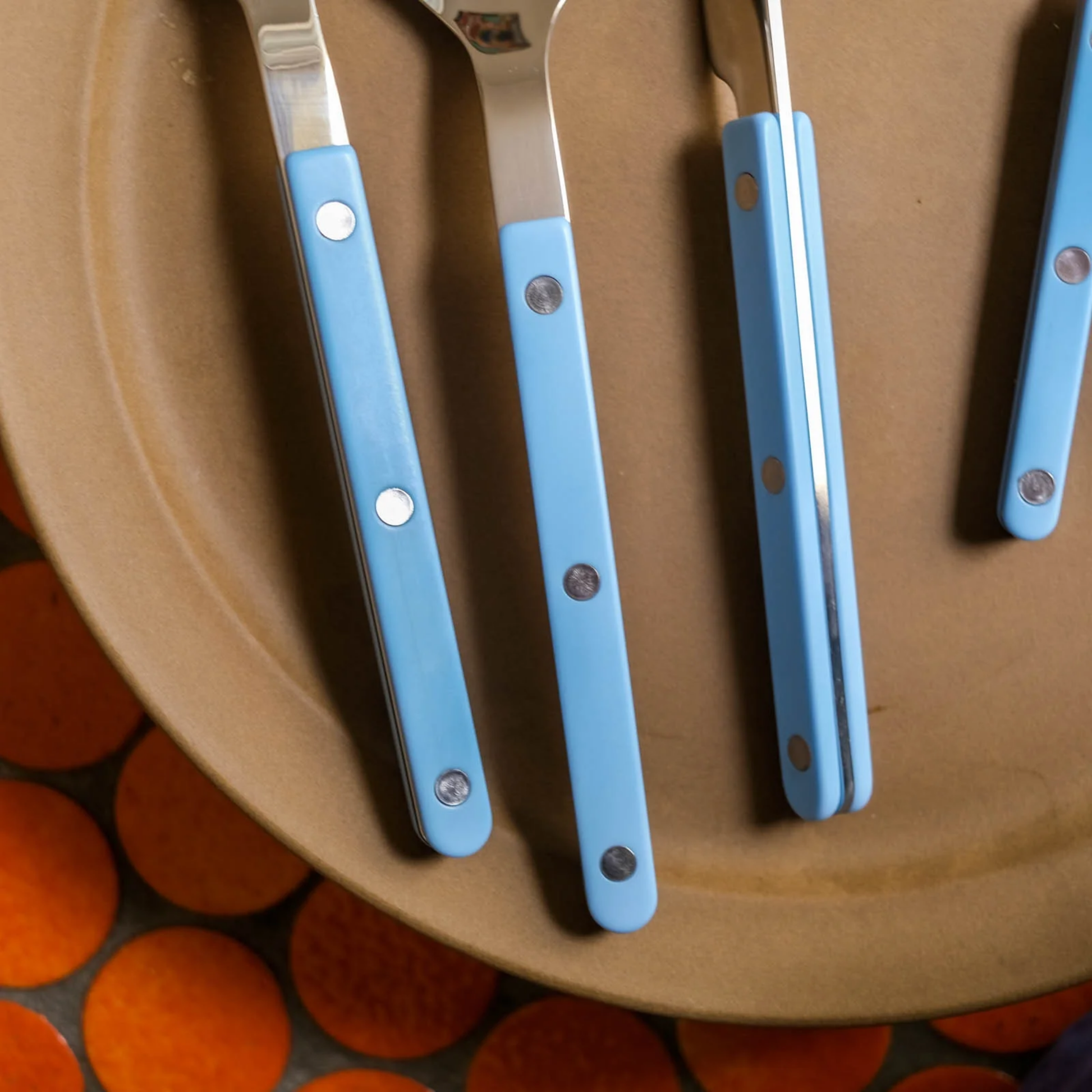 Close up on the side and front of the utensils from Sabre Bistrot Cutlery Pastel Blue 24 Piece Set
