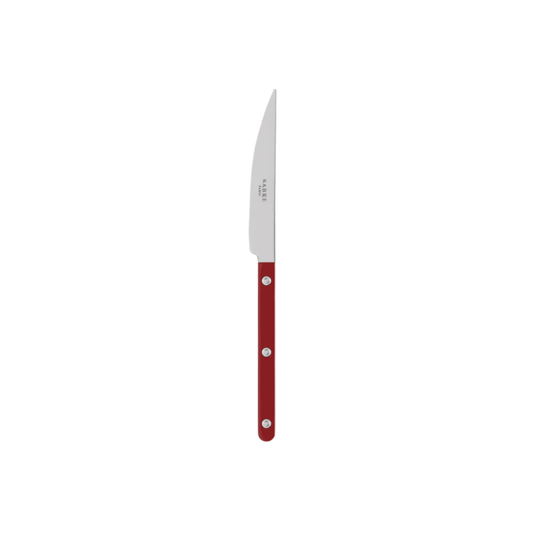 Sabre Paris Bistrot Dinner Knife Burgundy - 24cm stainless steel knife with colorful nylon handle and visible rivets. Designed with a sharp elegant blade inspired by French cafés, this durable and stylish dinner knife is available in gloss or vintage finishes and dishwasher-safe.