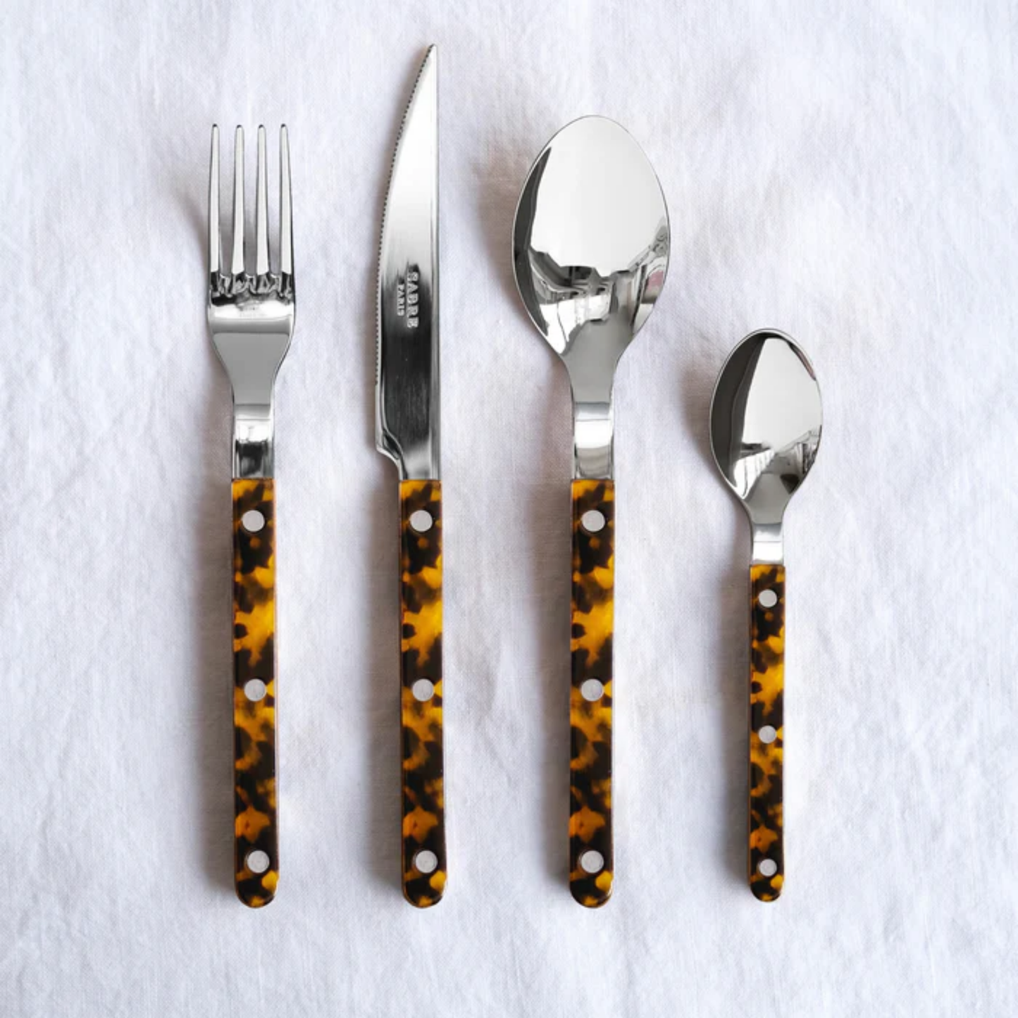 Size comparison image with Sabre Paris Bistrot Dinner Knife - 24cm stainless steel knife with colorful acrylic handle and café-style rivets. A sharp, elegant design blending traditional French charm with modern flair, perfect for everyday dining or refined table settings.