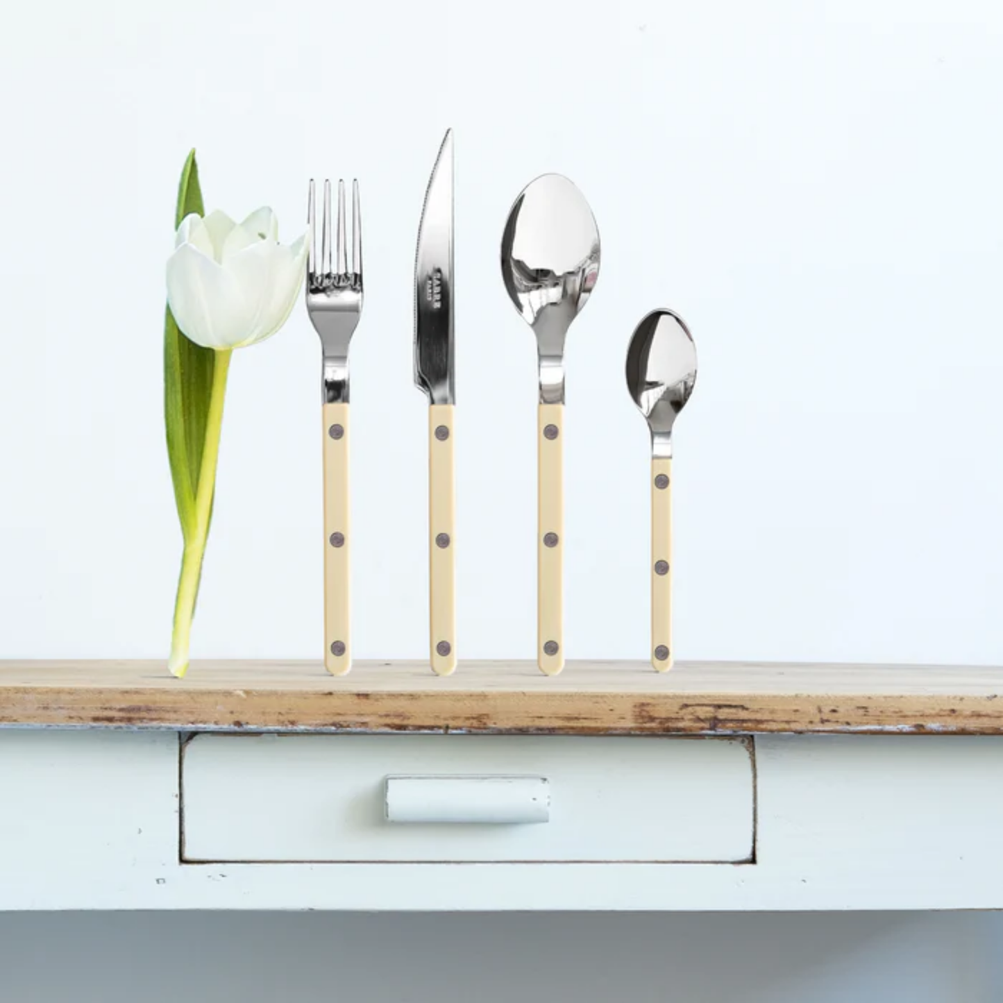 Shown with other utensils to show comparison with Sabre Paris Bistrot Teaspoon 16 cm Ivory - stainless steel and nylon café-style teaspoon with visible rivets, available in gloss or vintage finish, elegant and modern cutlery for everyday use.