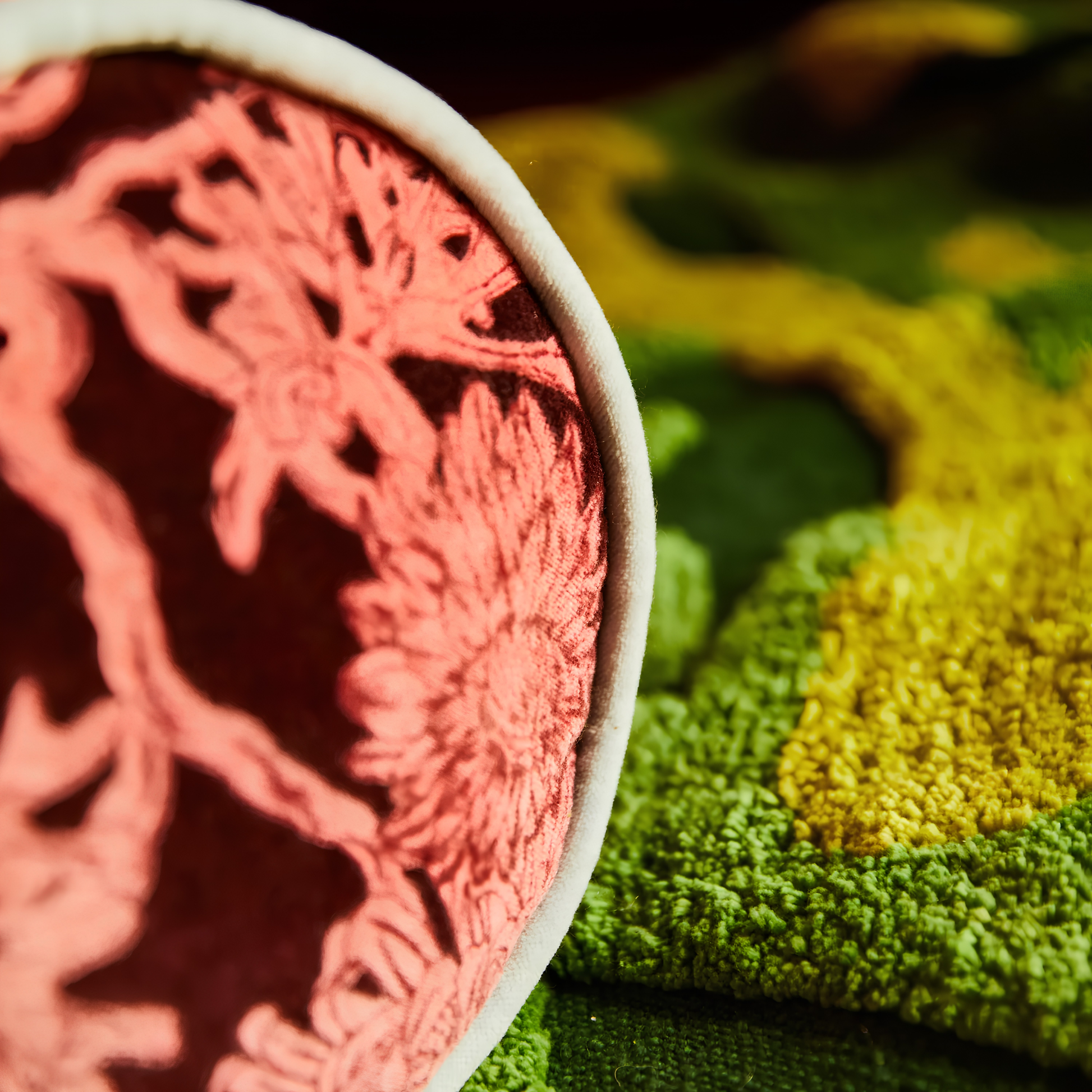 Close up on the side edges of the Sage & Clare Cushion Bolster Velvet Delphine that has a soft touch, piping edges and high quality insert.