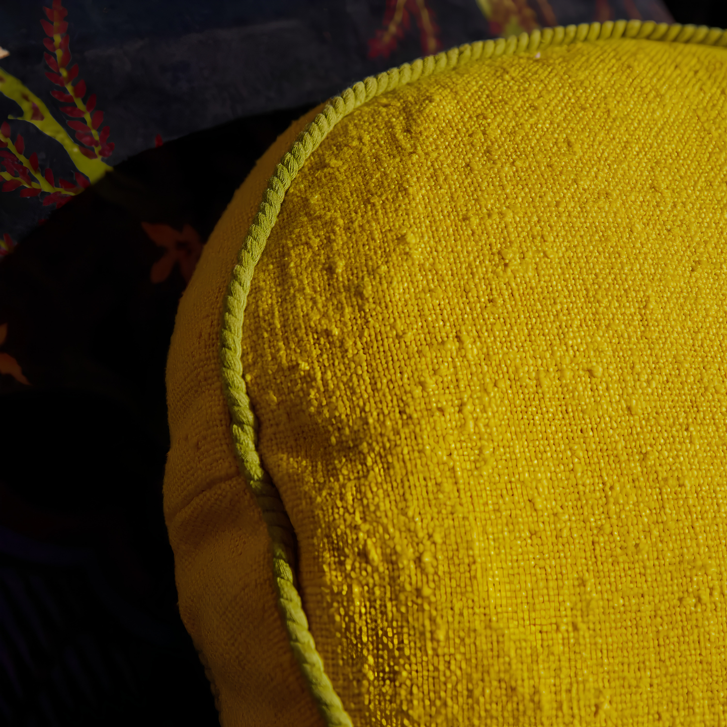 Close up on the cord piping of the Sage & Clare Cushion Dana Round Medallion made from cotton in block colours, with contrasting cord piping and high quality insert.