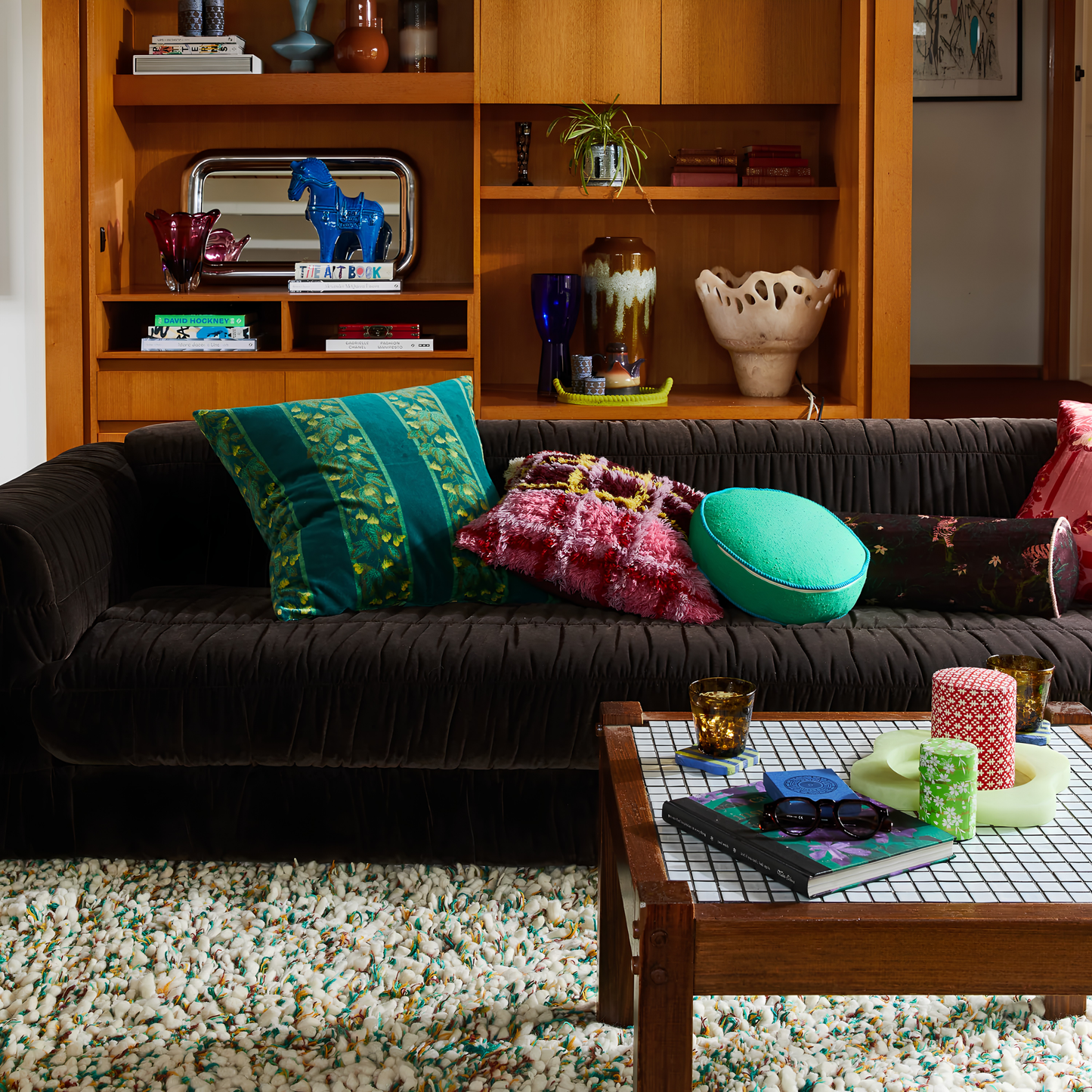 Sage & Clare Cushion Dana Round Spring Green made from cotton in block colours, with contrasting cord piping and high quality insert, seen on the couch with other pillows.