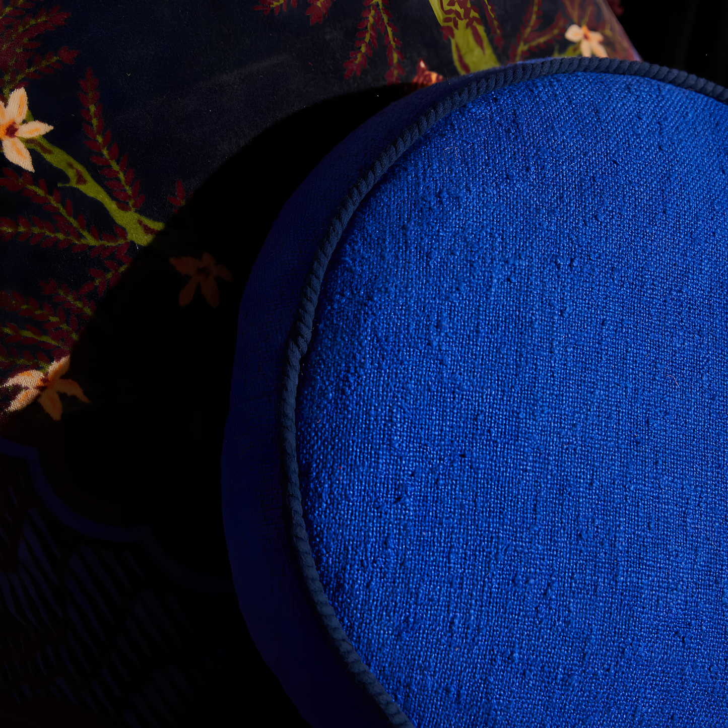 Close up on the cord piping of the Sage & Clare Cushion Dana Round Ultramarine made from cotton in block colours, with contrasting cord piping and high quality insert.