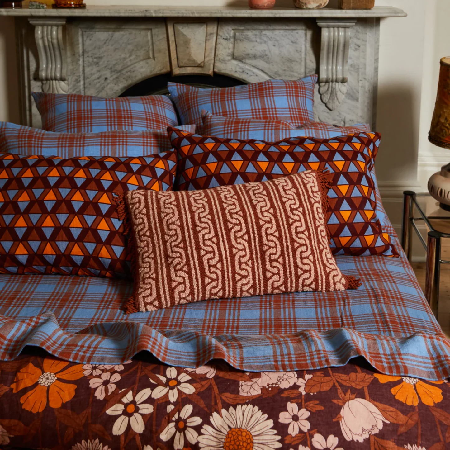 Sage & Clare Fidel Punch Needle Cushion on display on made bed