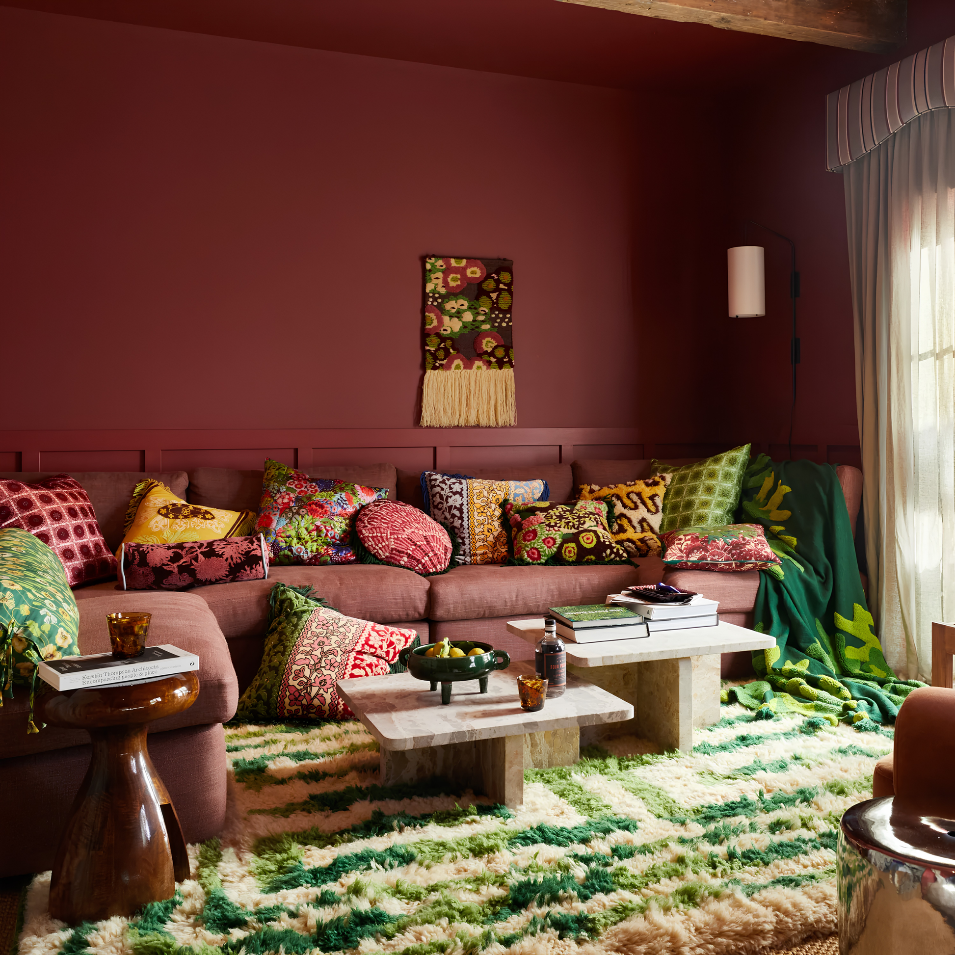 Wider angle view with the Sage & Clare Cushion Thea Velvet Kelp with plush texture, floral design, fringe edges and high quality insert.